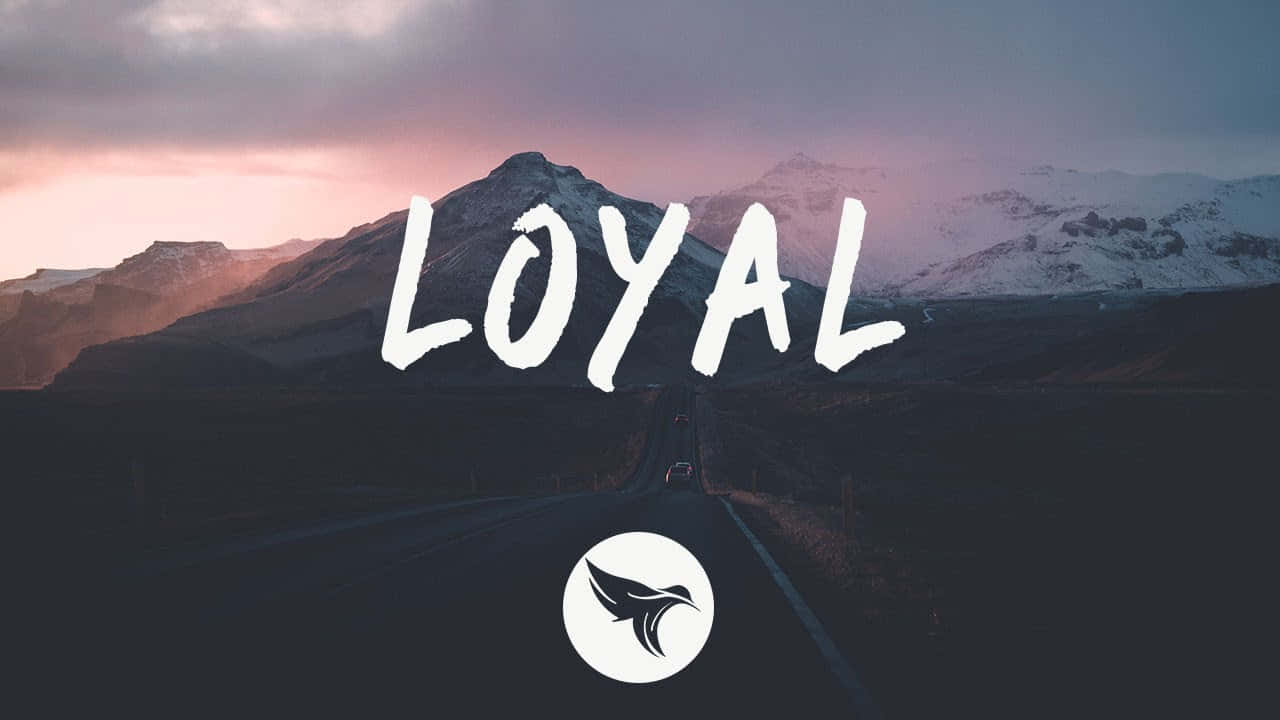 Loyal Text Graphics Over The Mountains Background