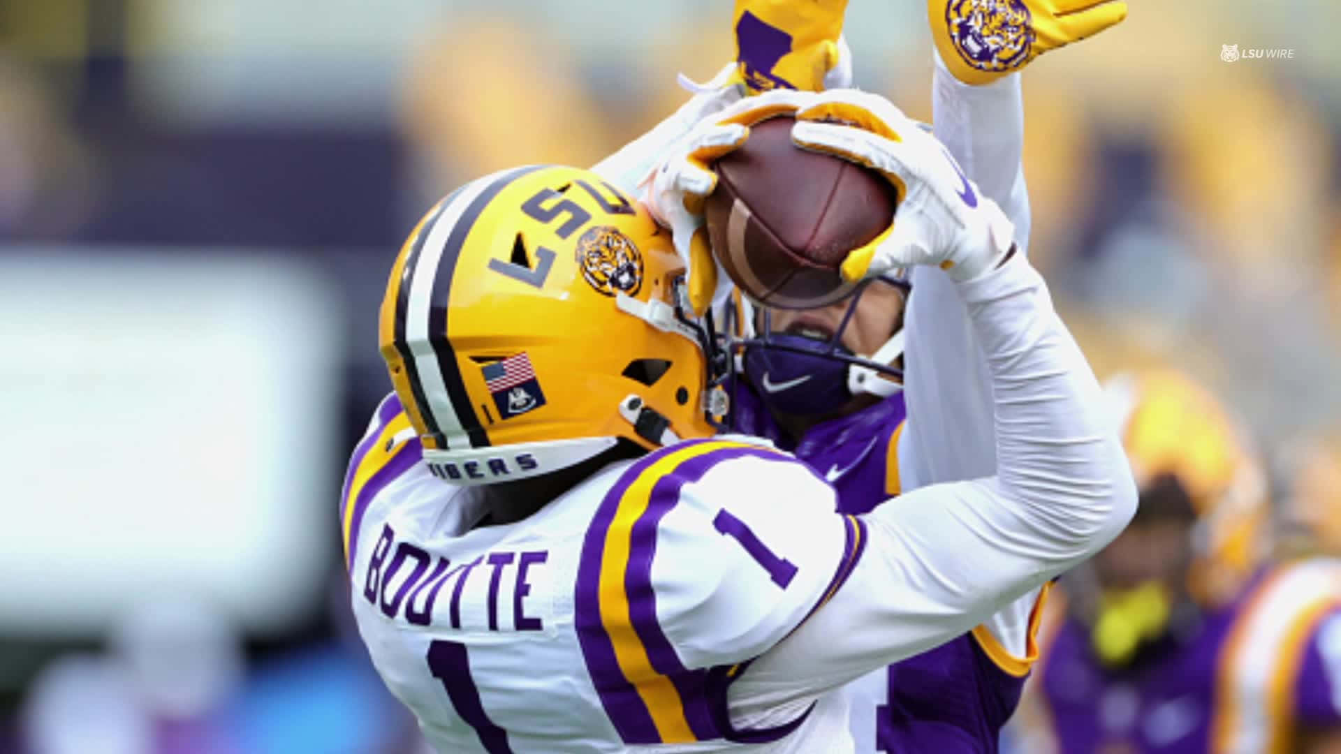 Lsu Football Hugging Ball Background