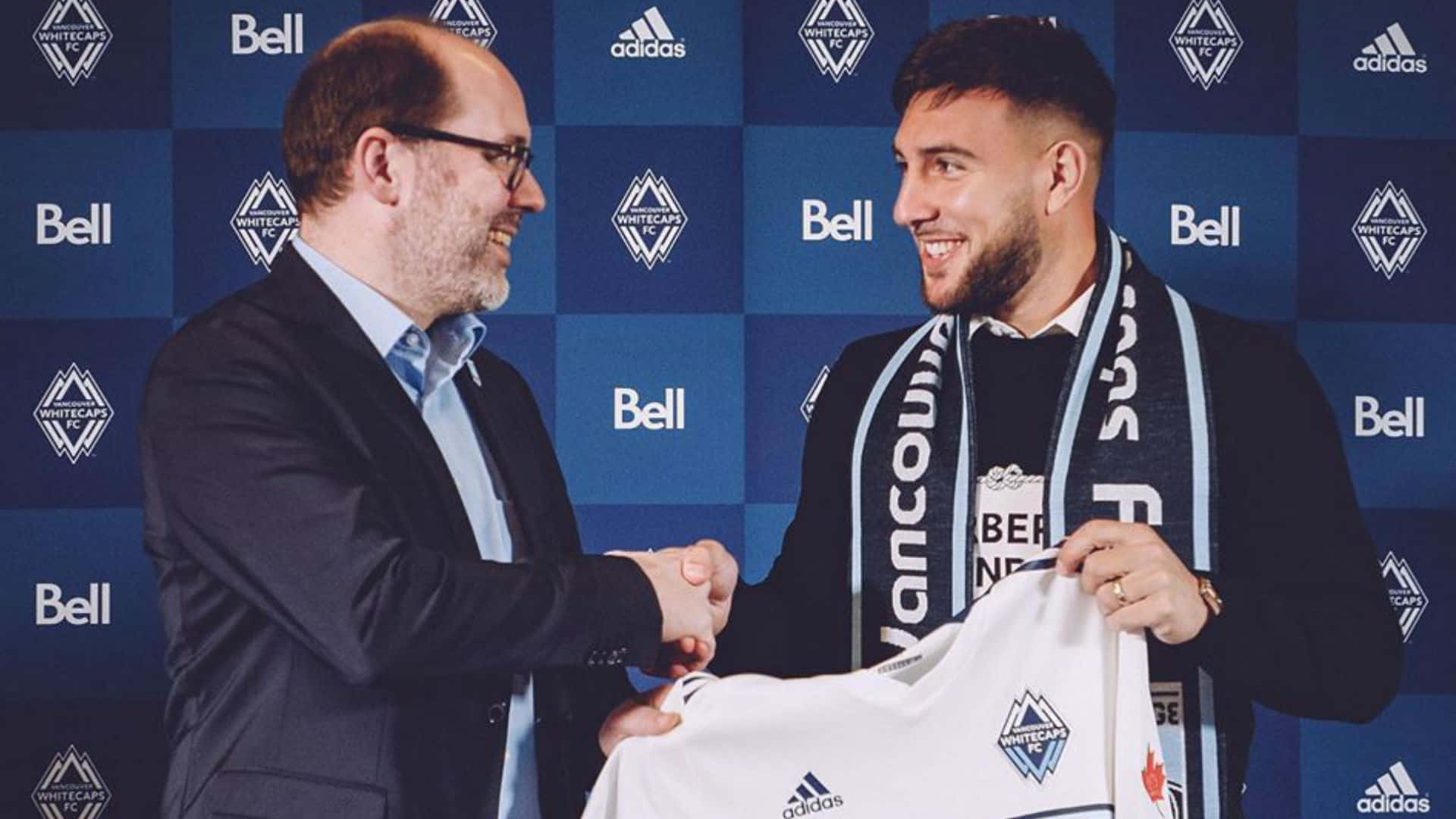 Lucas Cavallini Shaking Hands With Man Background