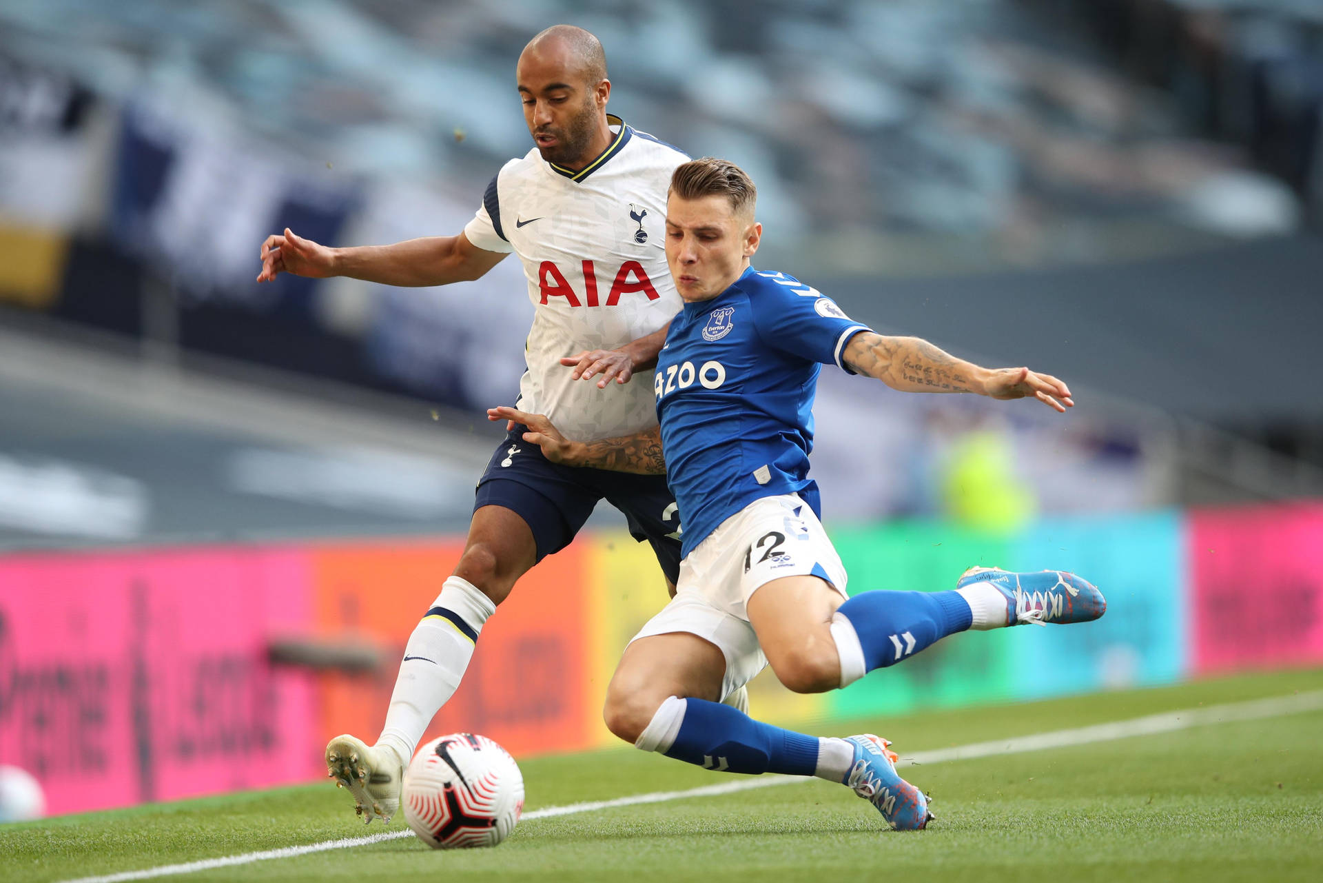 Lucas Digne Chasing Ball On Field Background