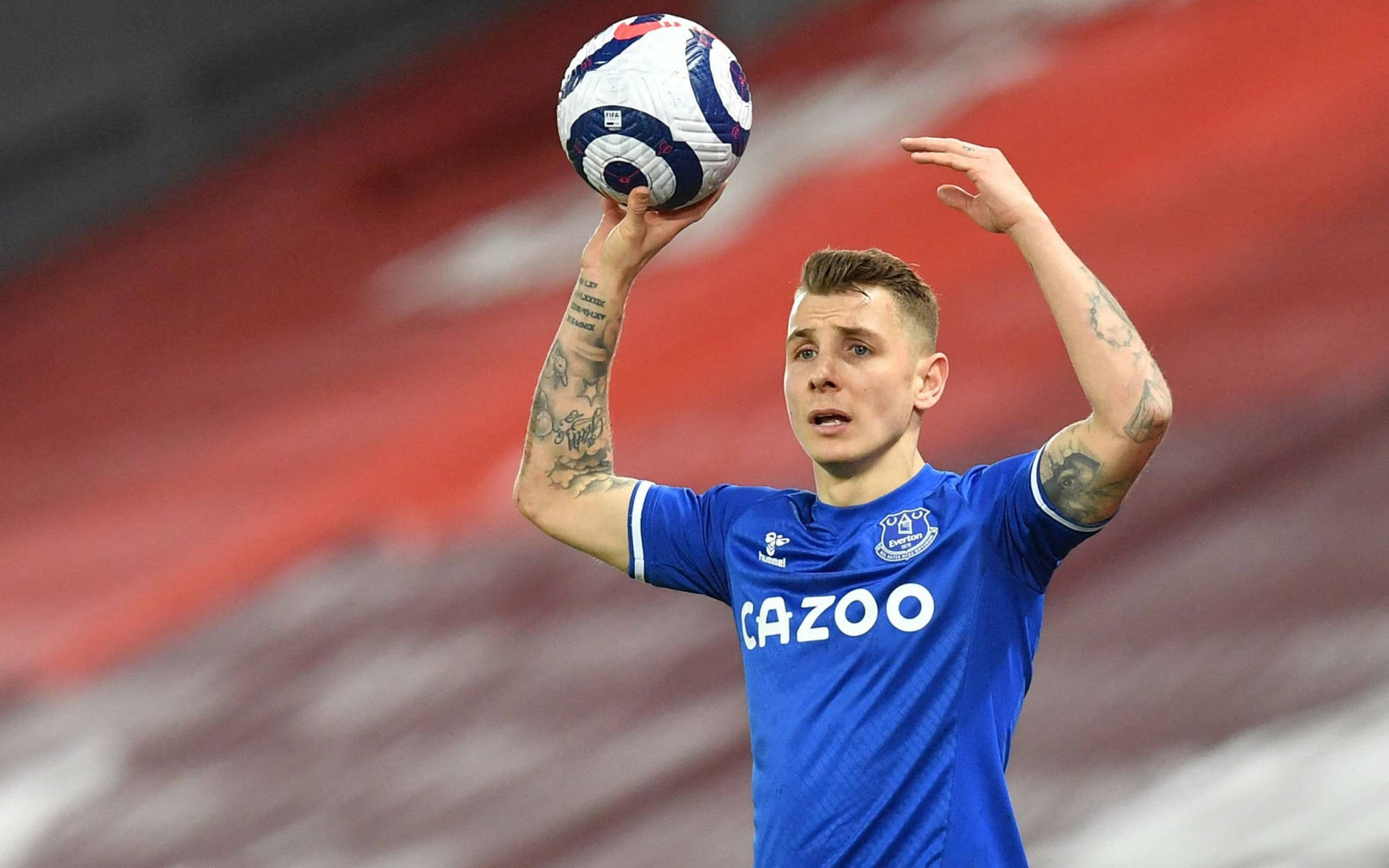 Lucas Digne Holding A Football Background