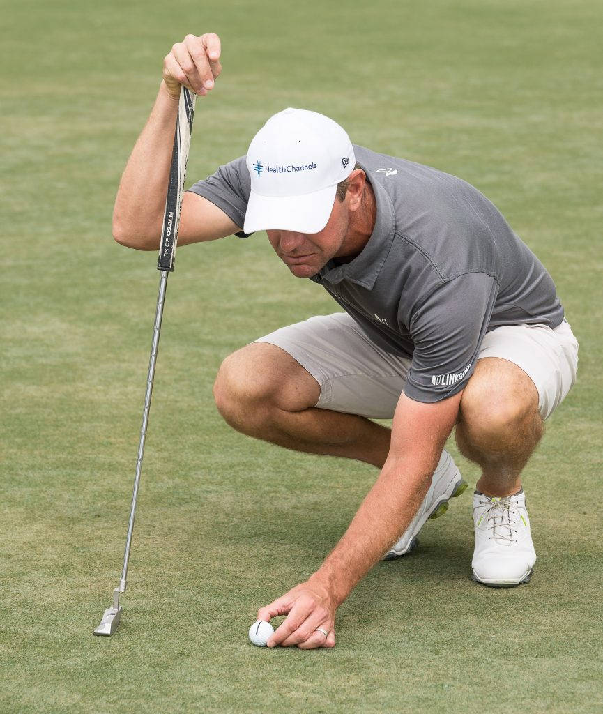 Lucas Glover Handling Golf Ball