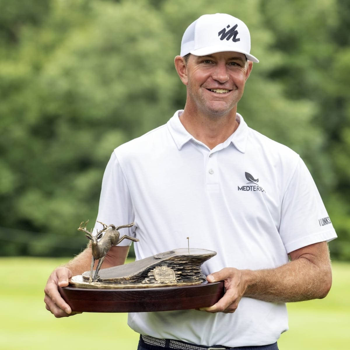 Lucas Glover Happily Holding Trophy Background