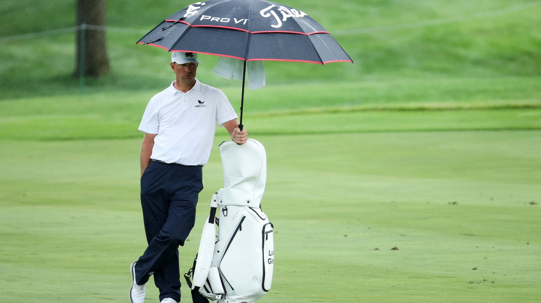 Lucas Glover Holding Umbrella Background