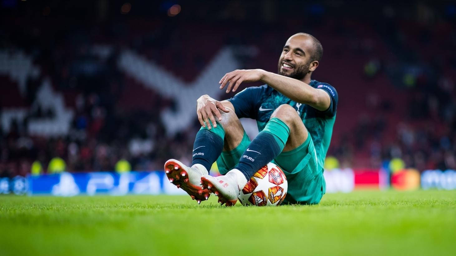 Lucas Moura Sitting On Football Field Background