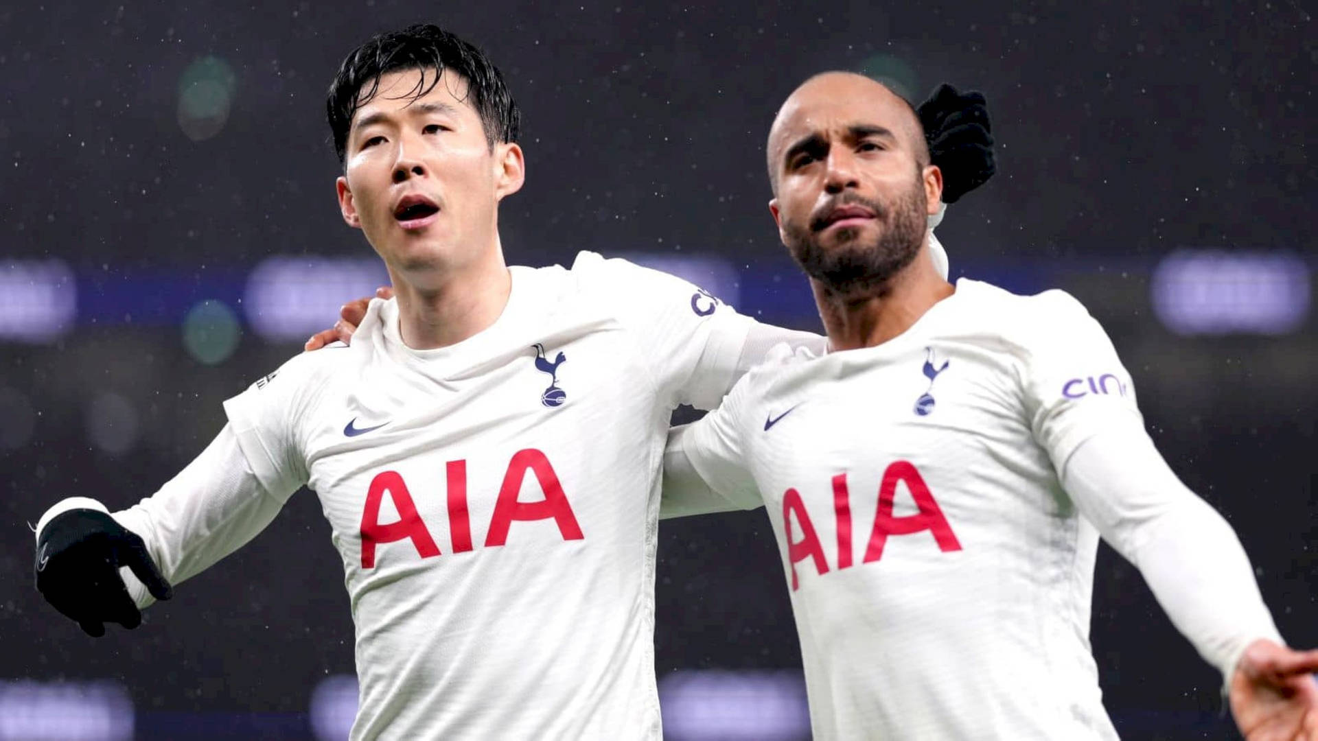 Lucas Moura With Teammate Under Rain Background