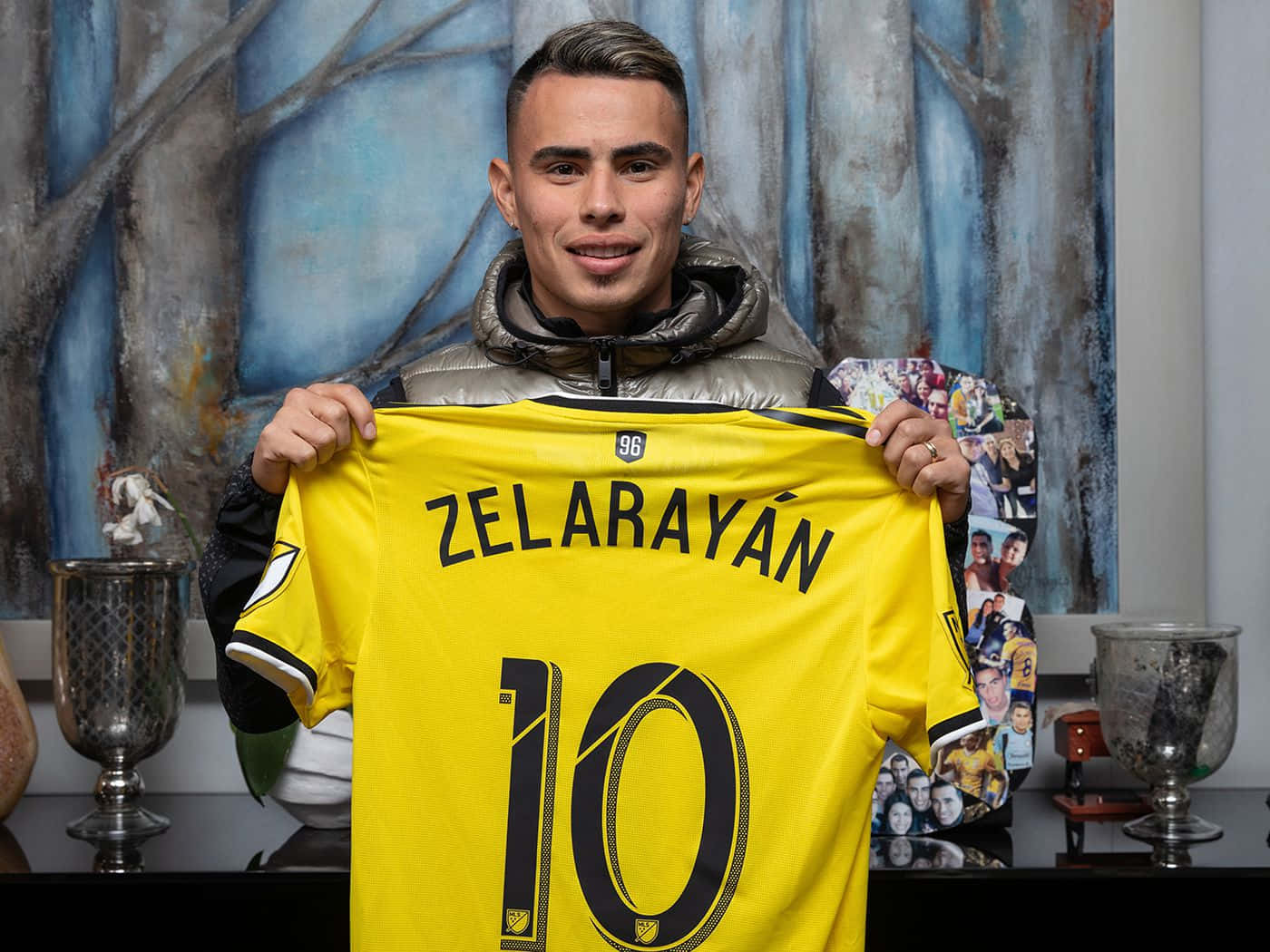 Lucas Zelarayan Holding His Columbus Crew Jersey Background