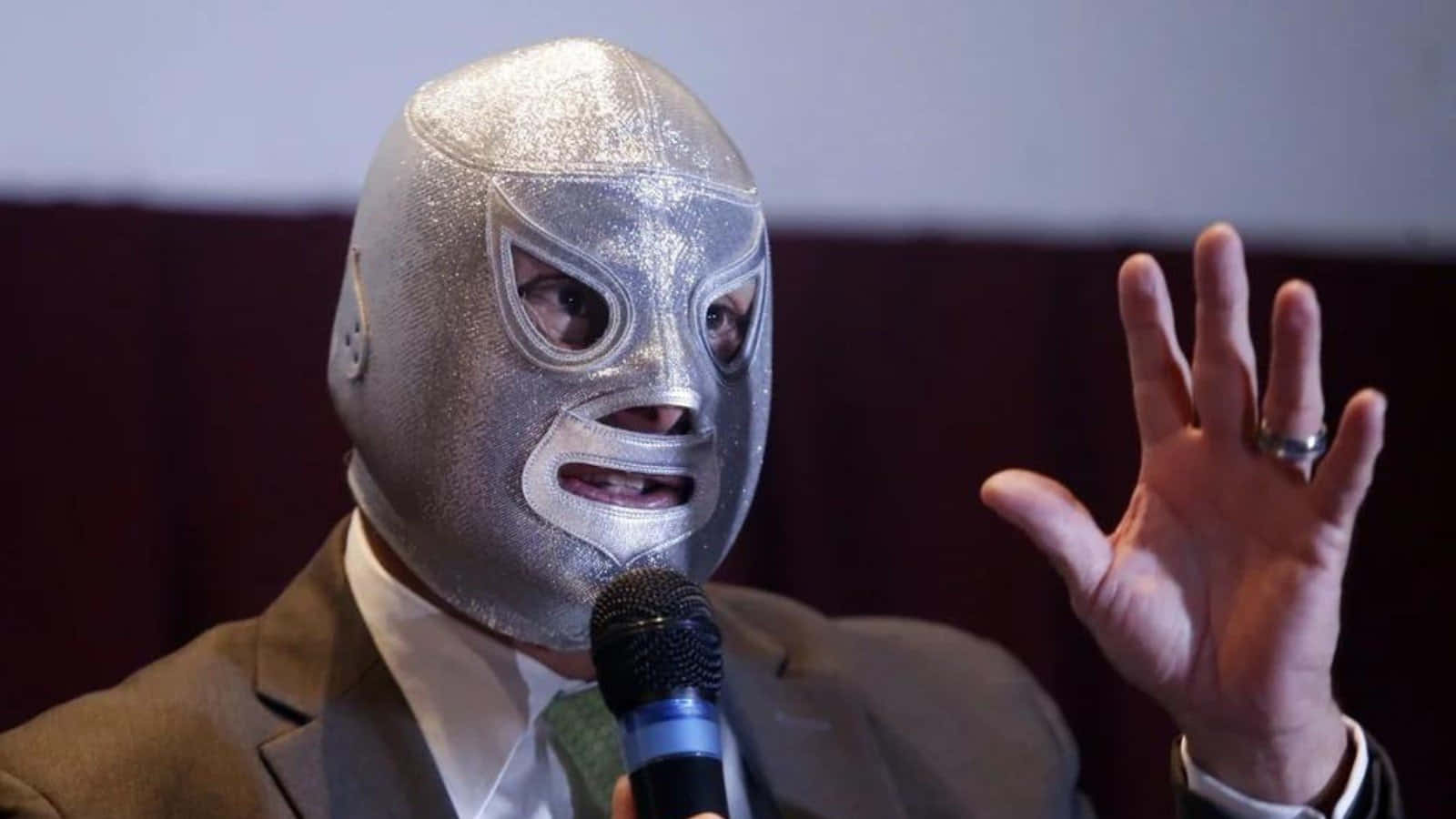 Luchador El Santo Speaking Event Background