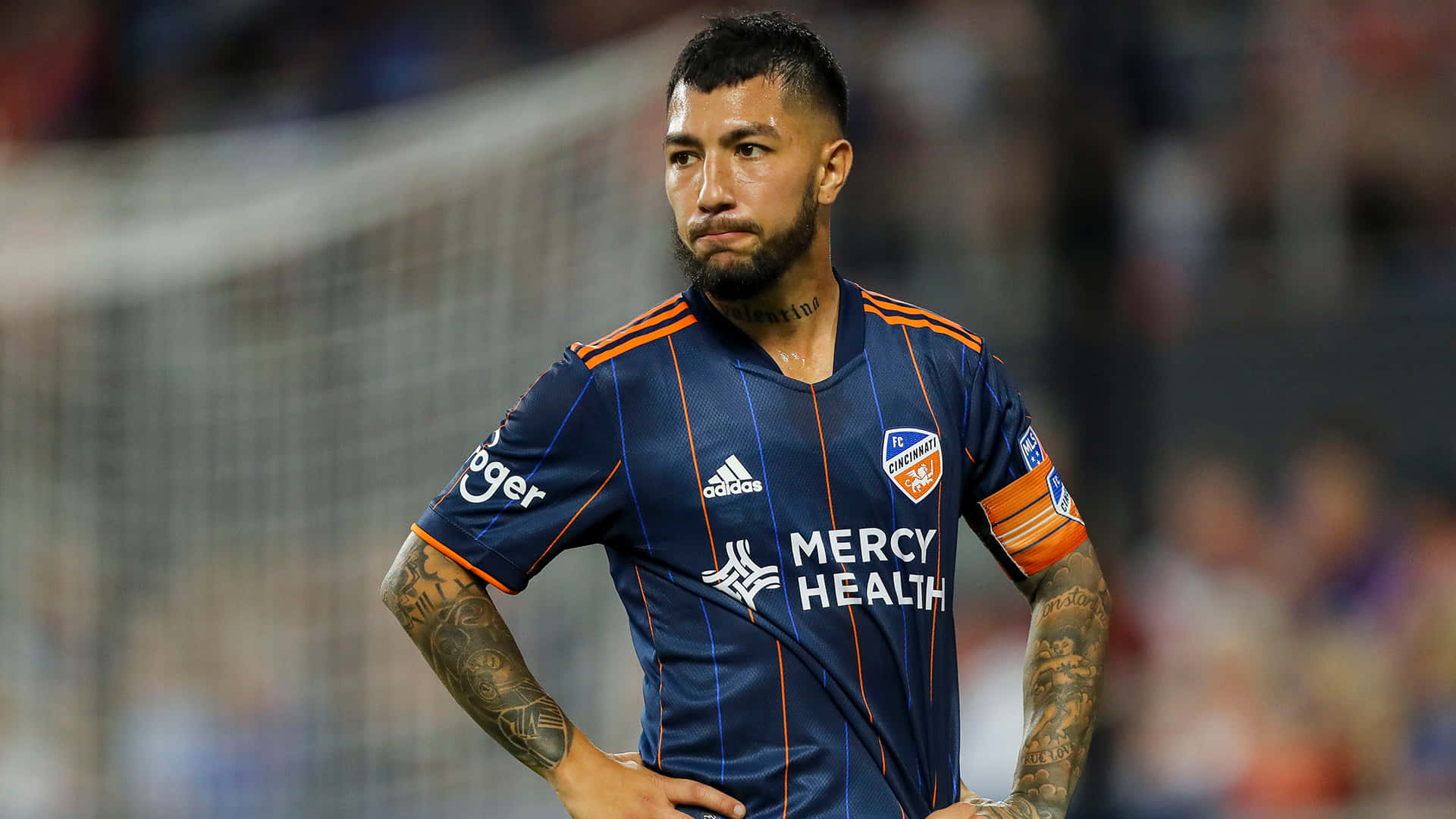 Luciano Acosta In Action On The Football Field Background