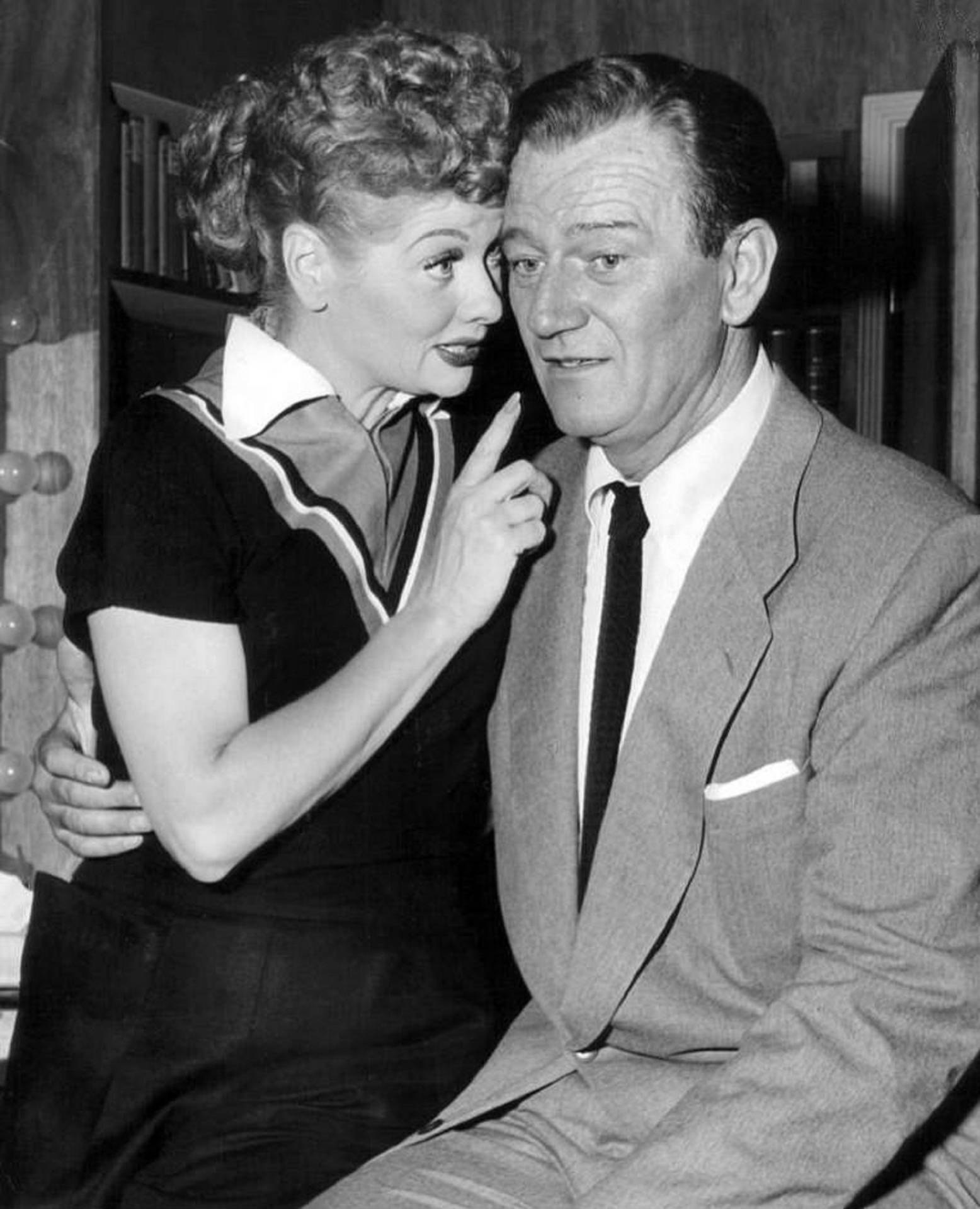 Lucille Ball Whispering To John Wayne Background