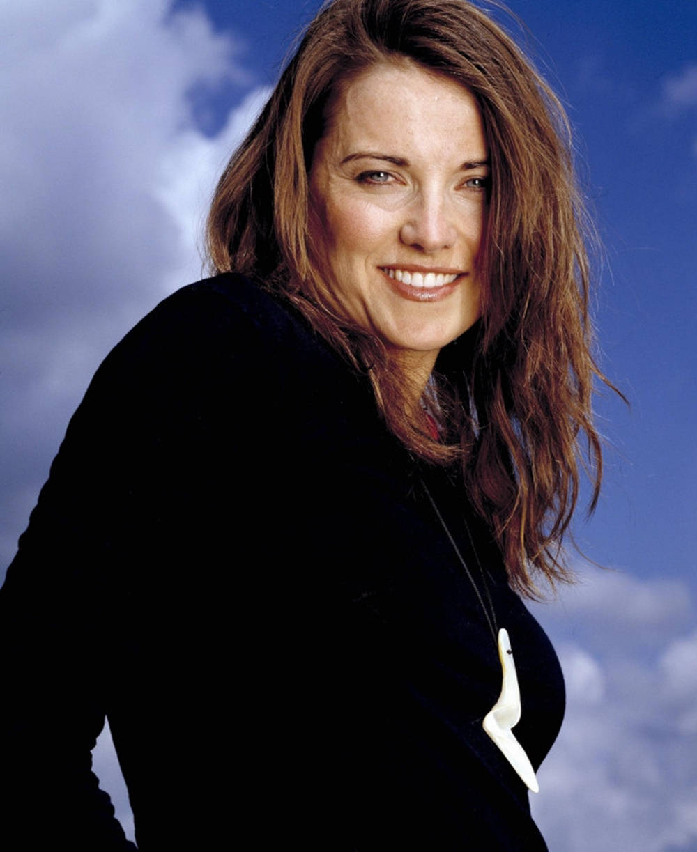 Lucy Lawless Against Blue Skyline Background