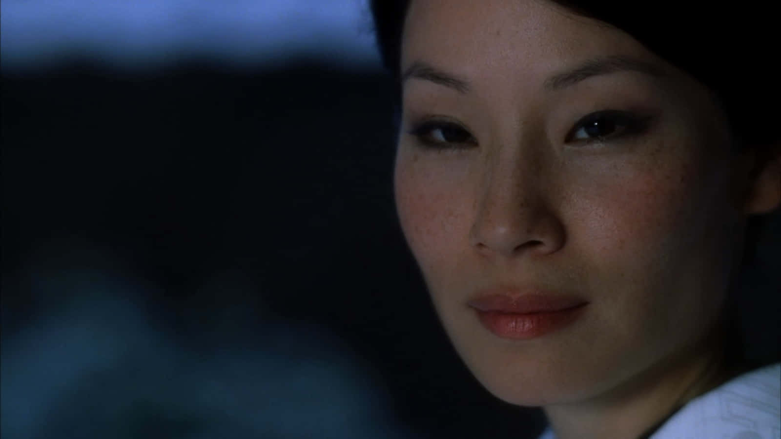 Lucy Liu Poses For A Closeup Photograph Background