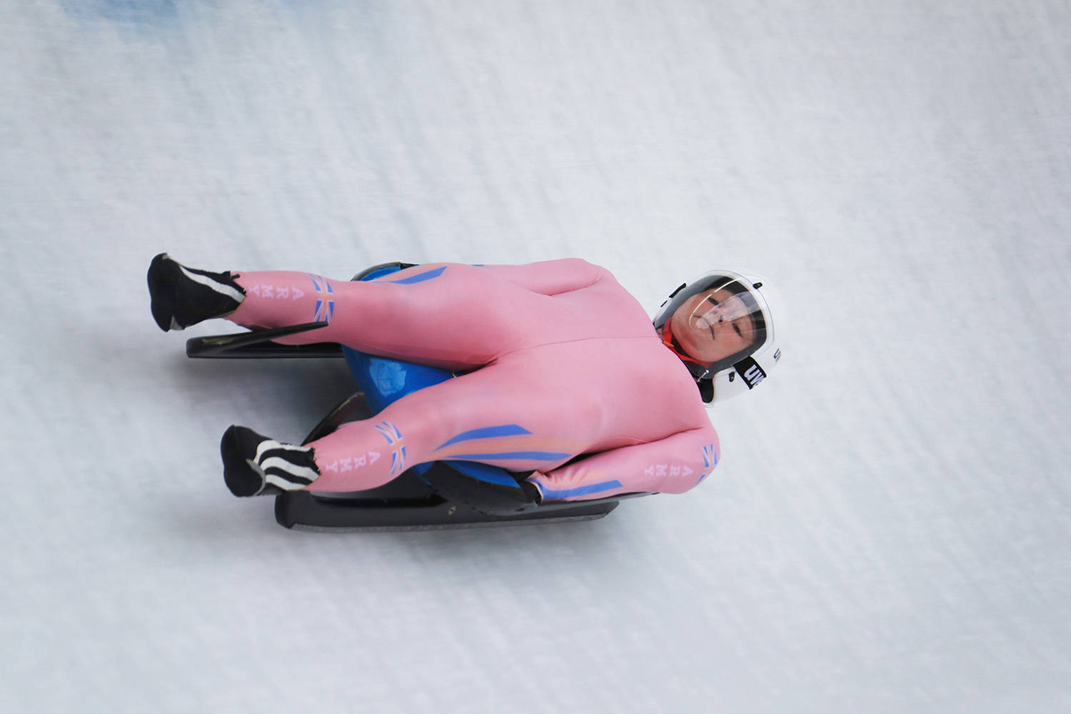 Lucy Wyatt In Pink Luge Suit Background