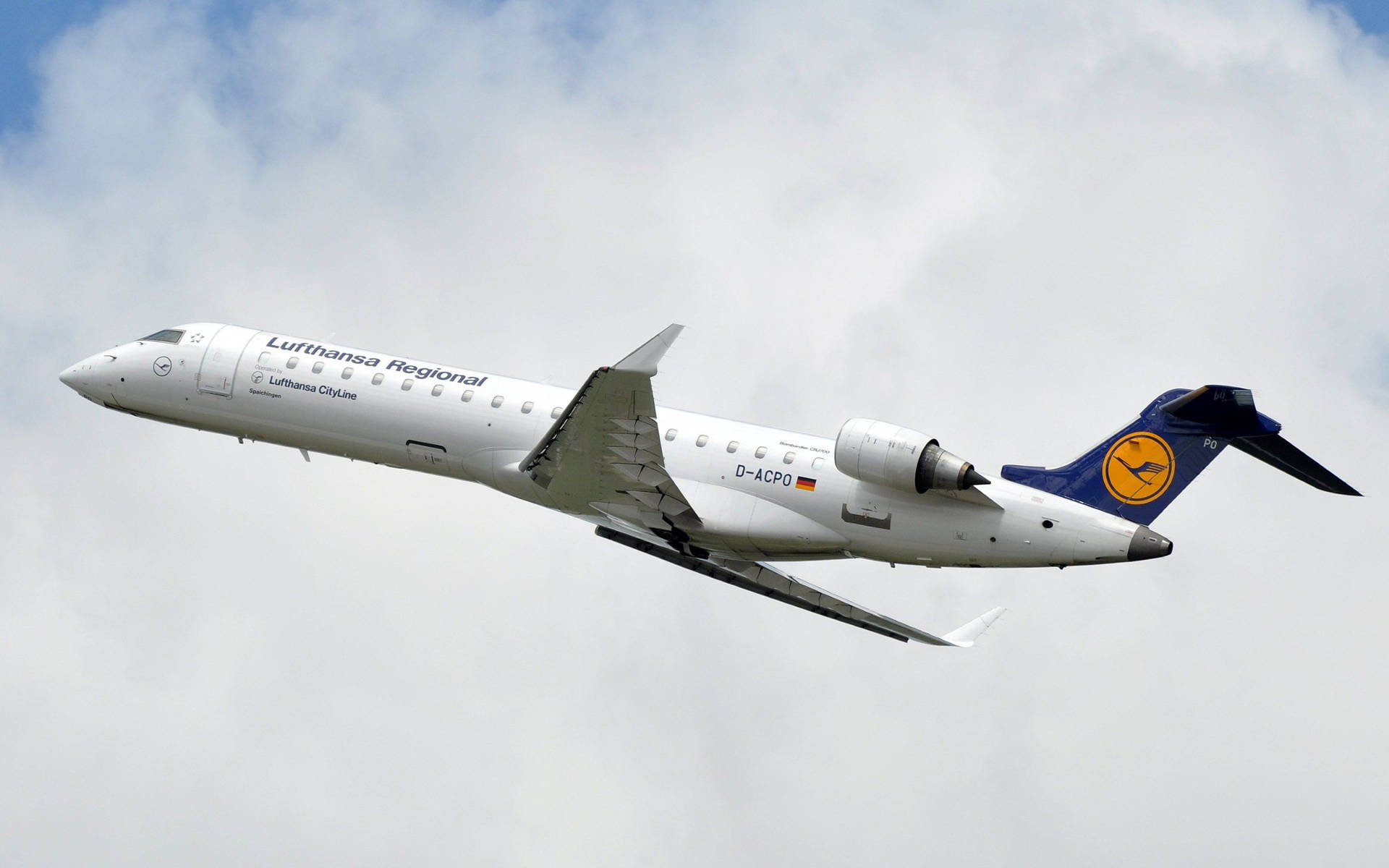 Lufthansa Plane In The Cotton Clouds Background