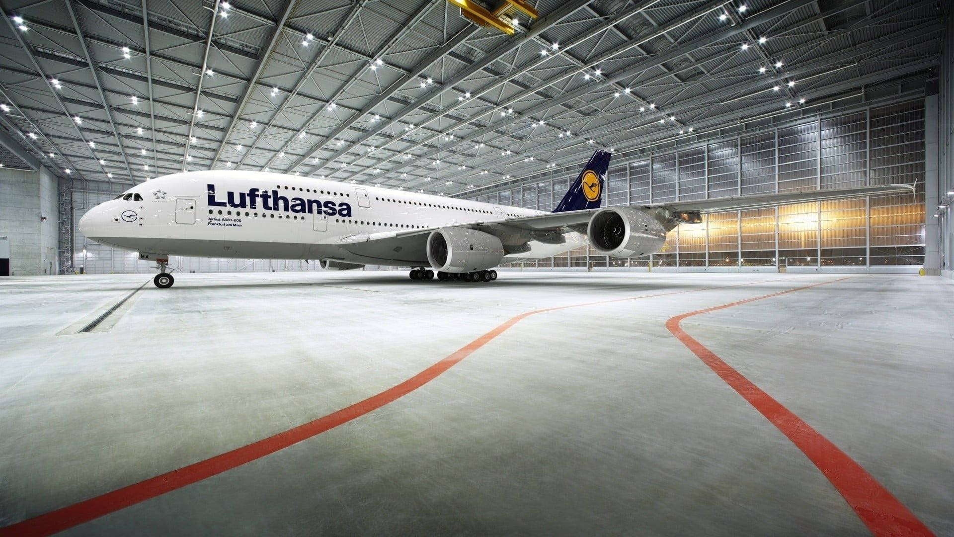 Lufthansa Plane Within A Hangar Background