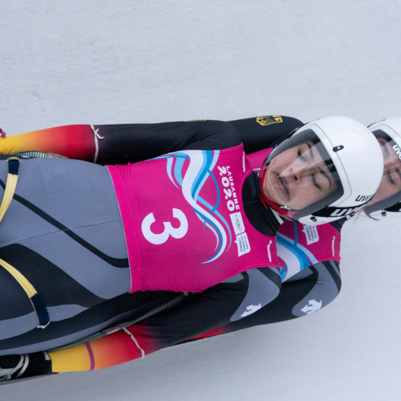 Luge Athletes In Pink Suits