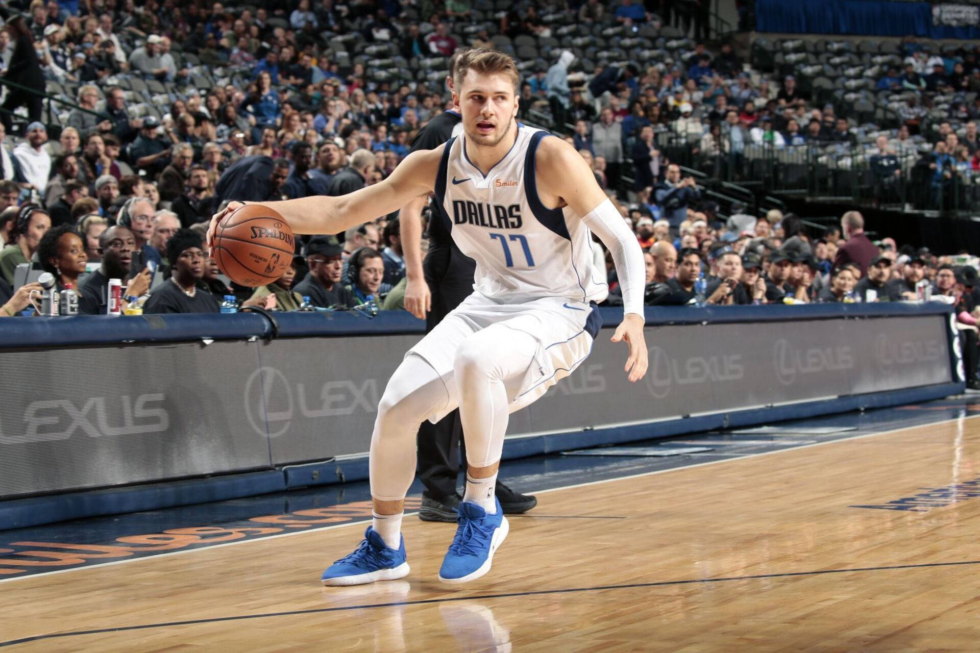 Luka Doncic In White Dallas Background