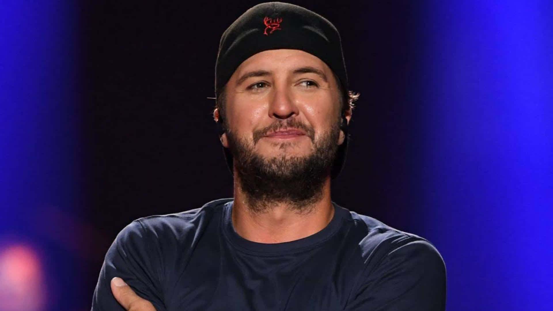 Luke Bryan Performing At A Concert Background