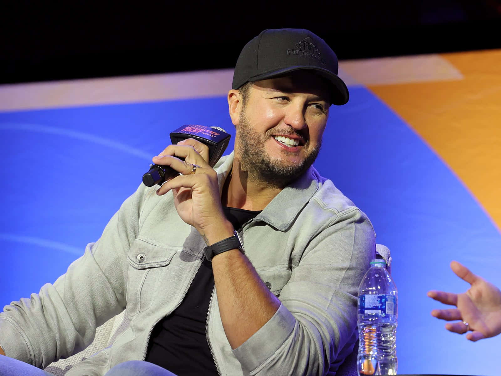 Luke Bryan Takes Center Stage On A Bright And Shining Night Background