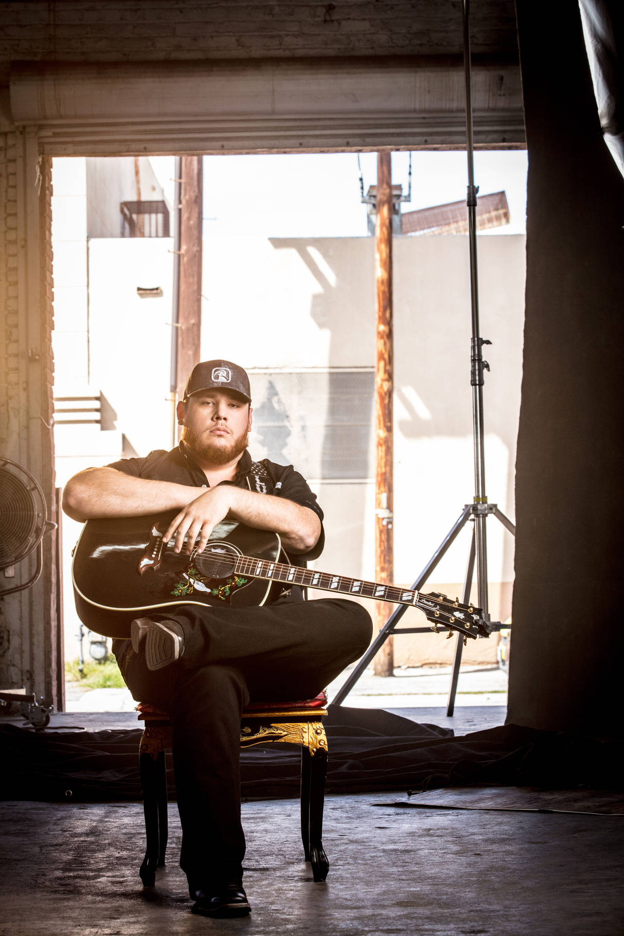 Luke Combs On Stage Performing At An Event Background