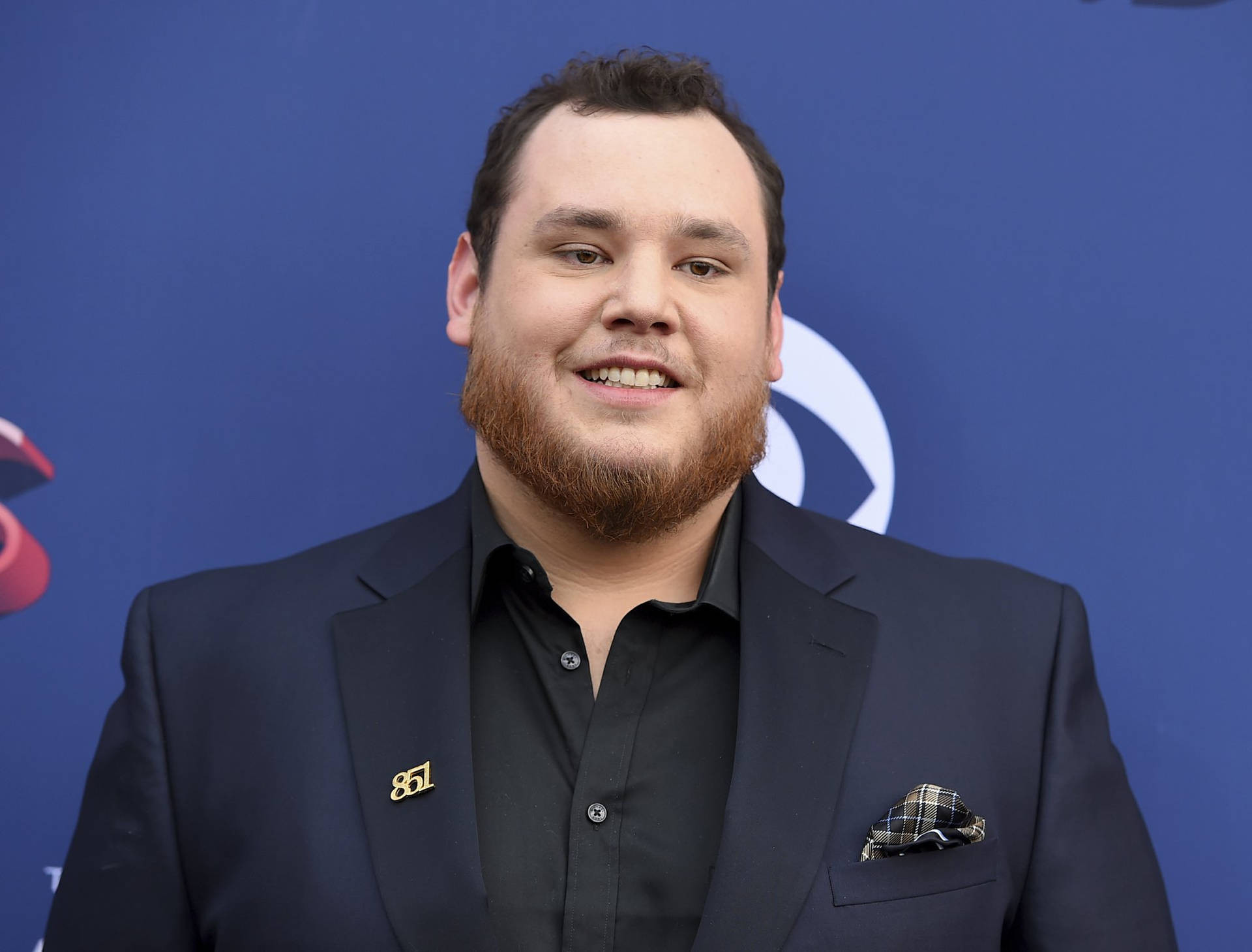 Luke Combs Performing In Concert Background