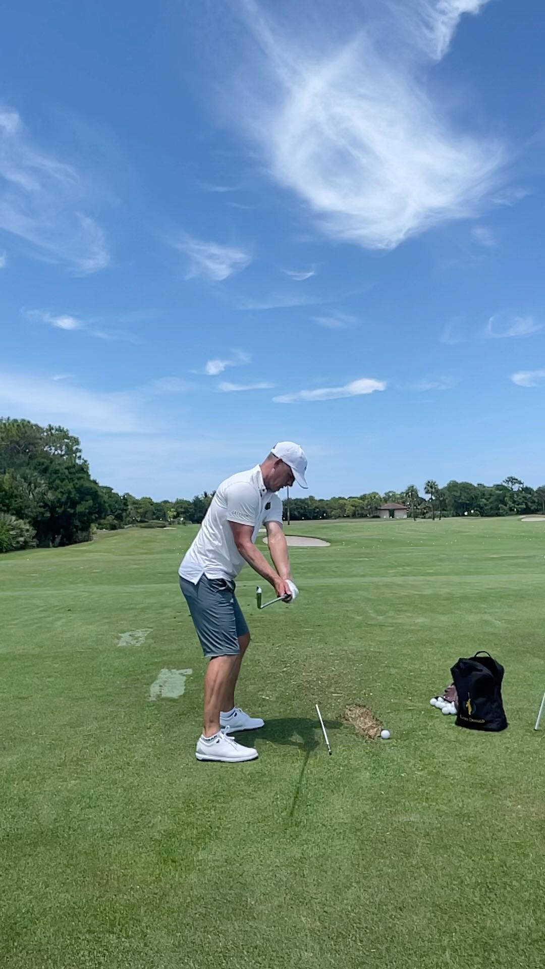 Luke Donald Performing A Golf Swing On A Sunny Day Background