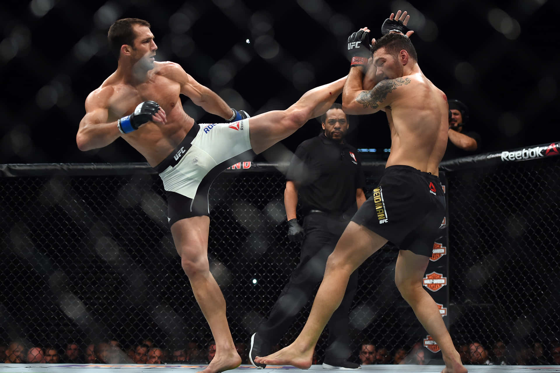 Luke Rockhold Delivers High Kick To Chris Weidman In Ufc Bout Background