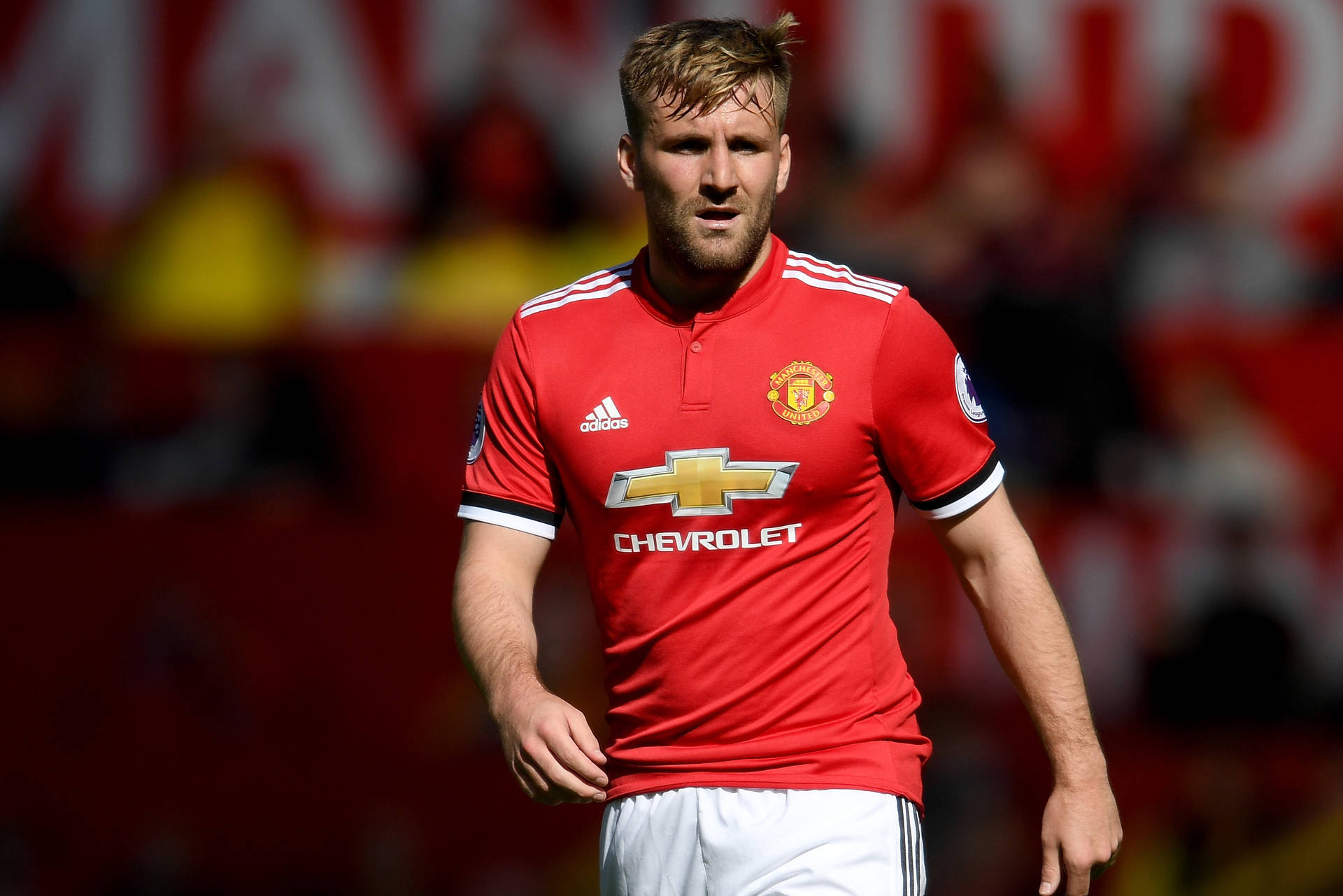 Luke Shaw Playing For Manchester United Background