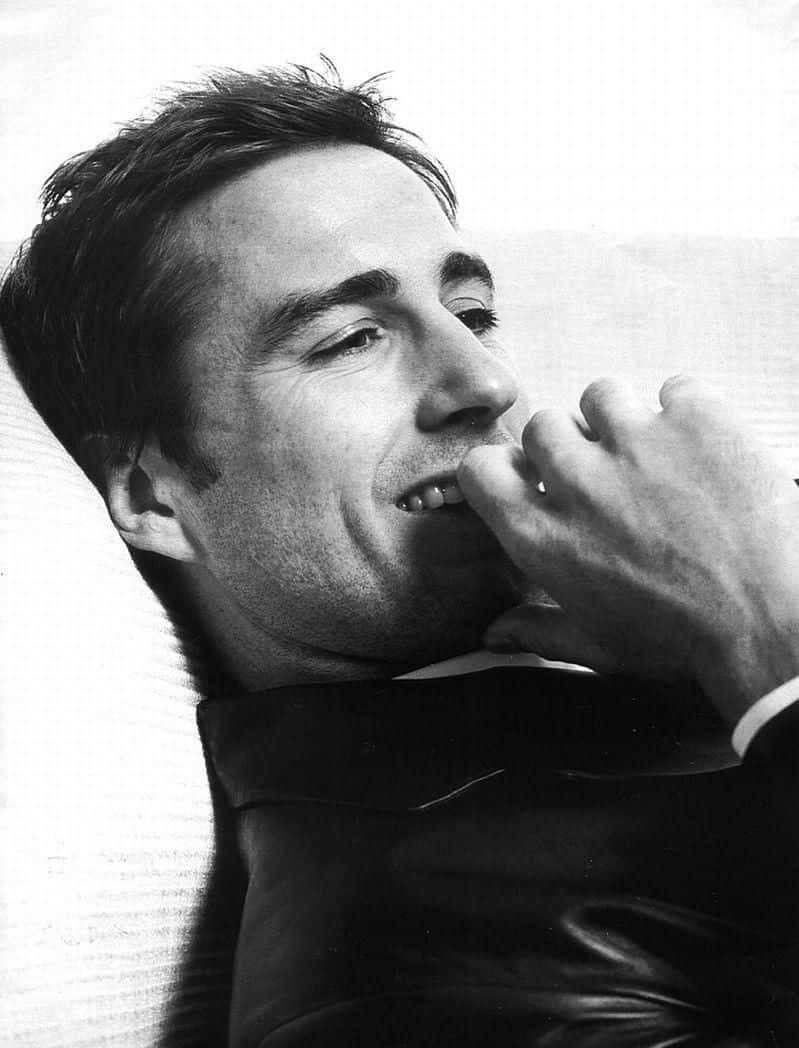 Luke Wilson Posing For A Photoshoot Background