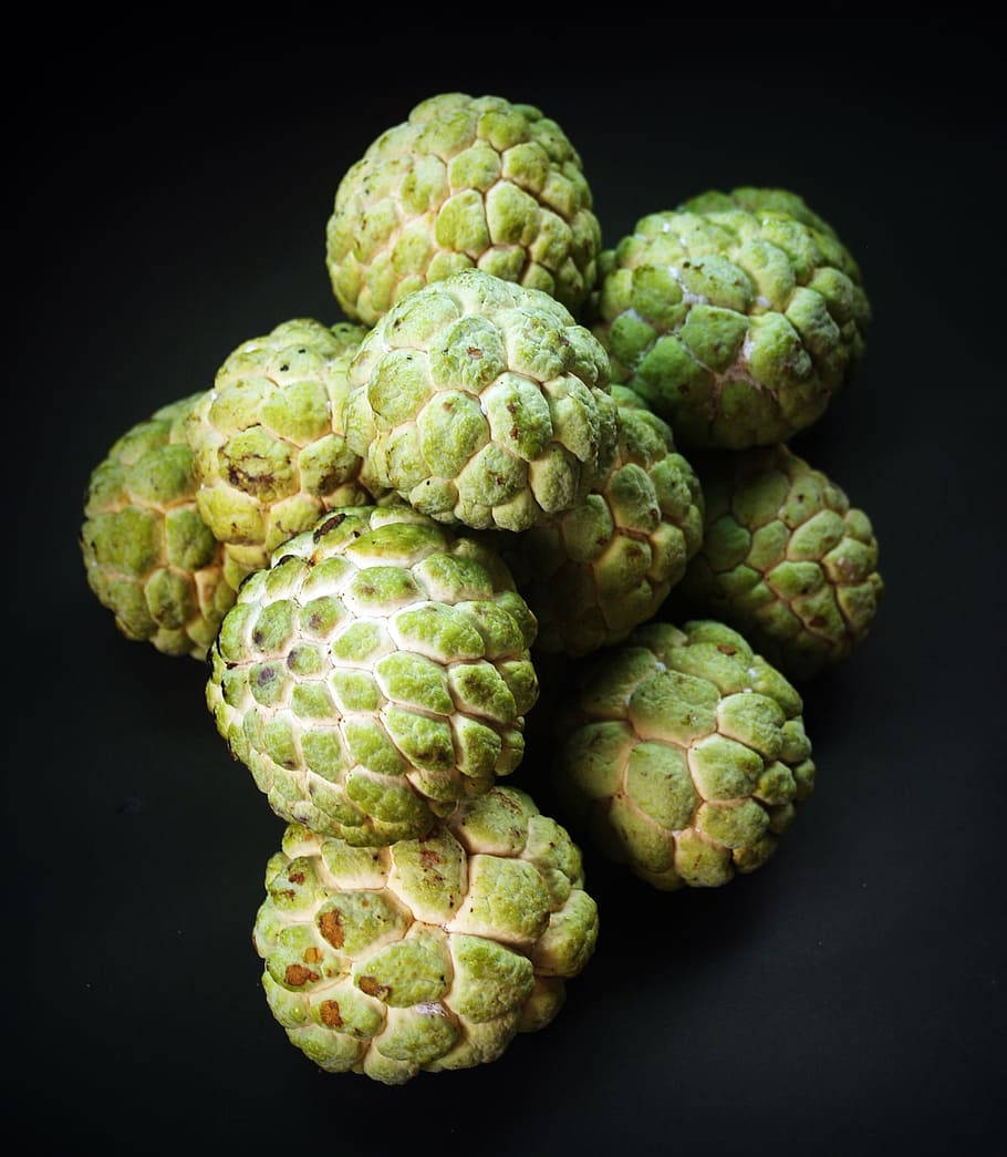 Luscious Custard Apples On A Dark Backdrop Background