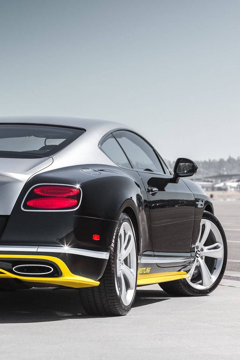 Luxurious Bentley Car In Black & Yellow Background