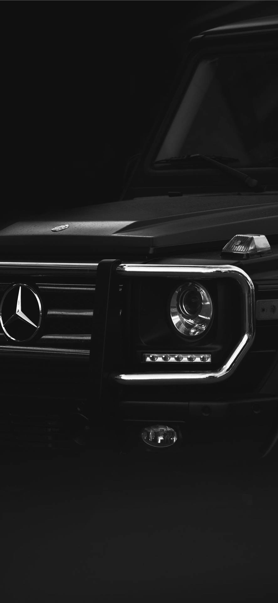 Luxurious Mercedes Benz Car Highlighting Sophisticated Headlight Background