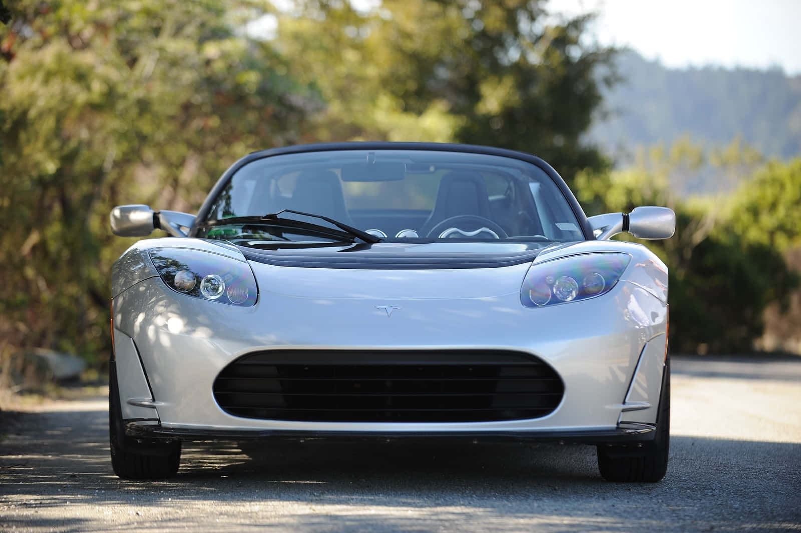 Luxurious Tesla Roadster - Innovation Meets Performance Background