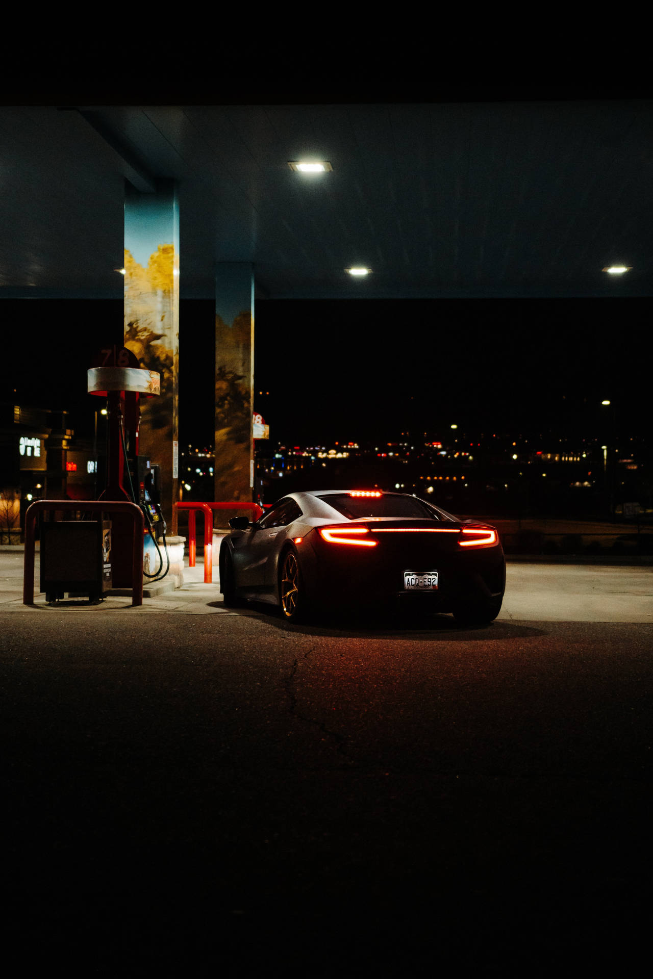 Luxury Car In Gas Station Background