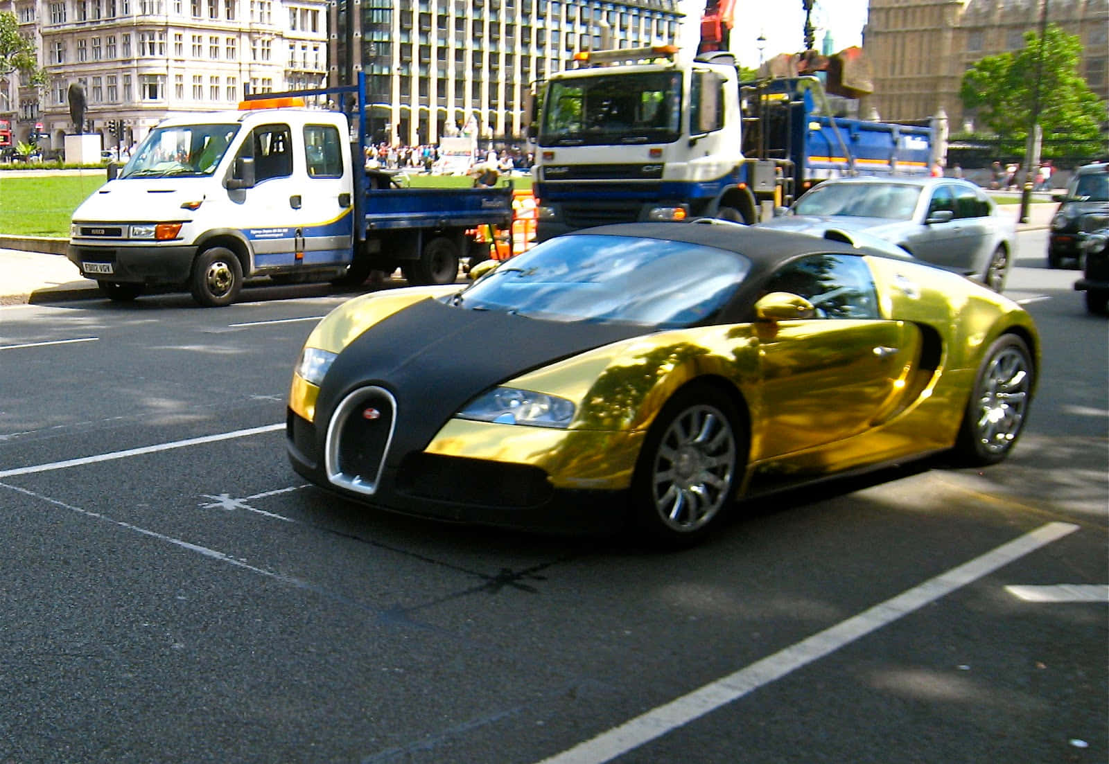 Luxury Meets Power With The Iconic Gold Bugatti Veyron Background