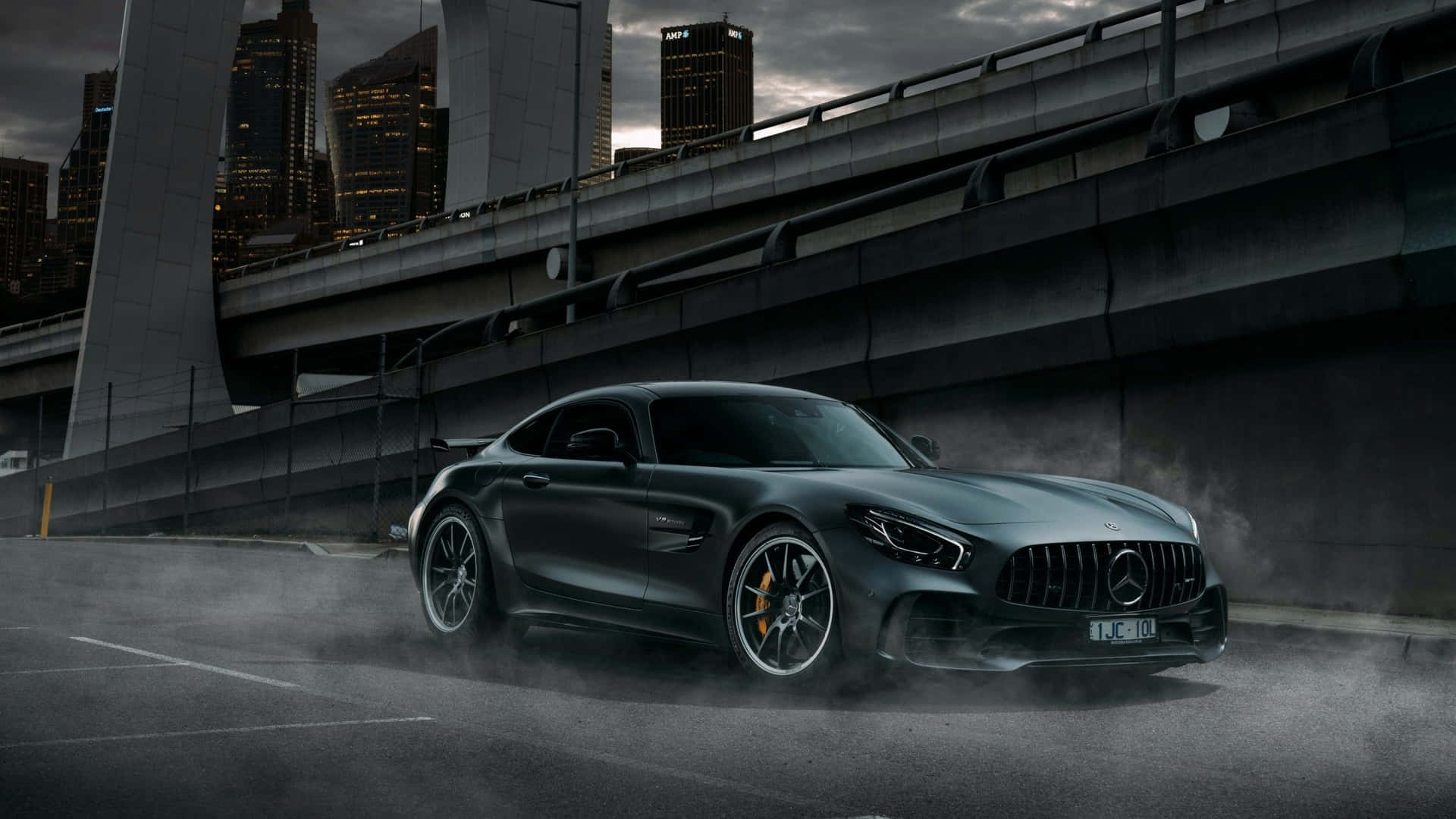 Luxury Mercedes Black Sitting Majestically In The Showroom Background