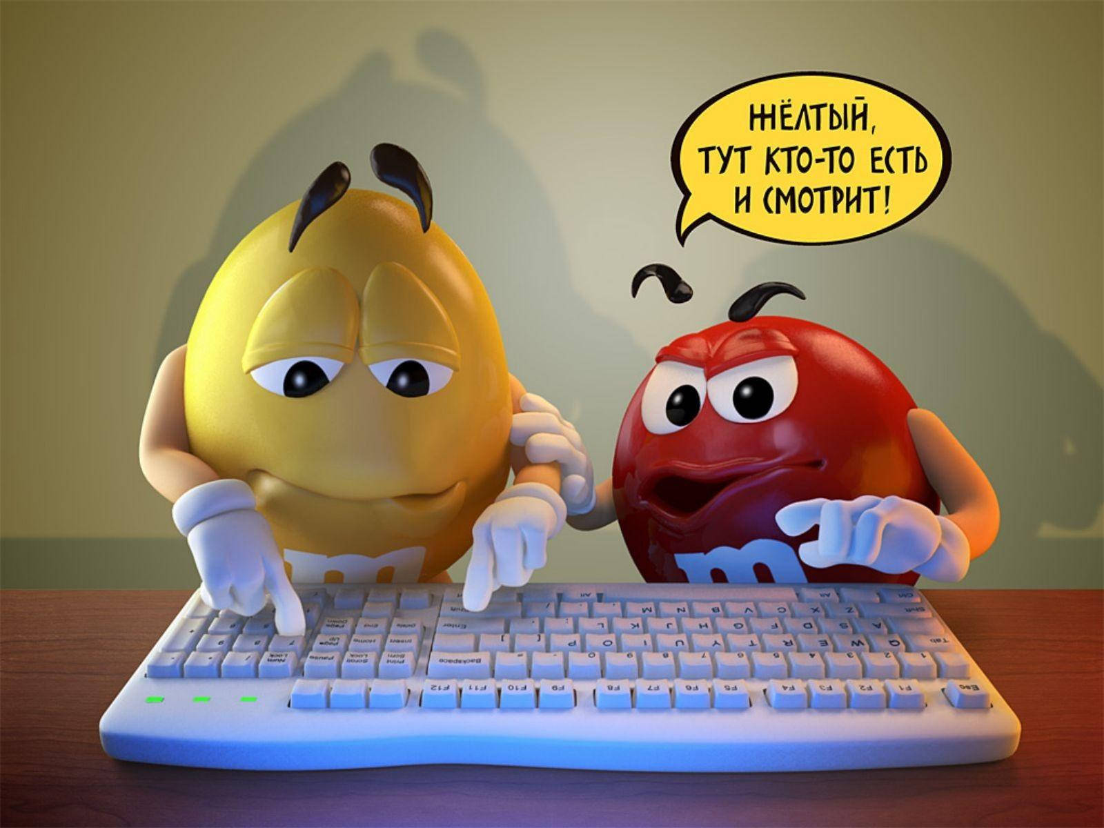 M&m's Yellow And Red Characters With A Keyboard Background