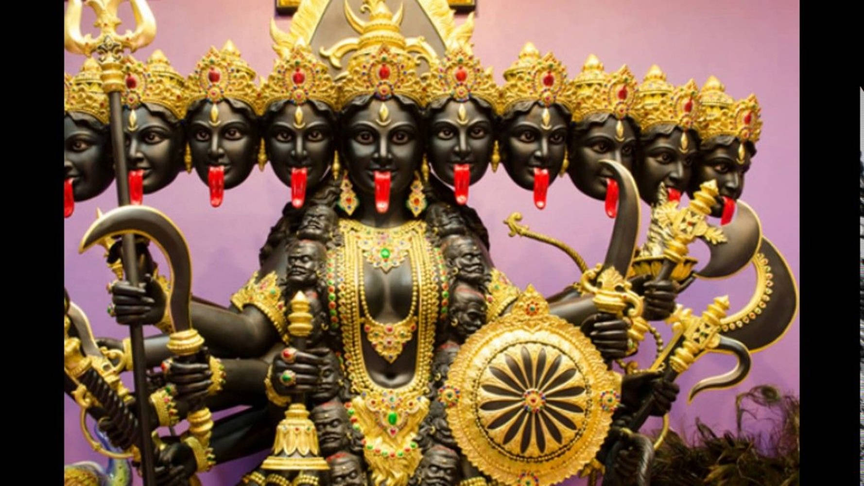 Maa Kali Black Statue Multiple Heads Background