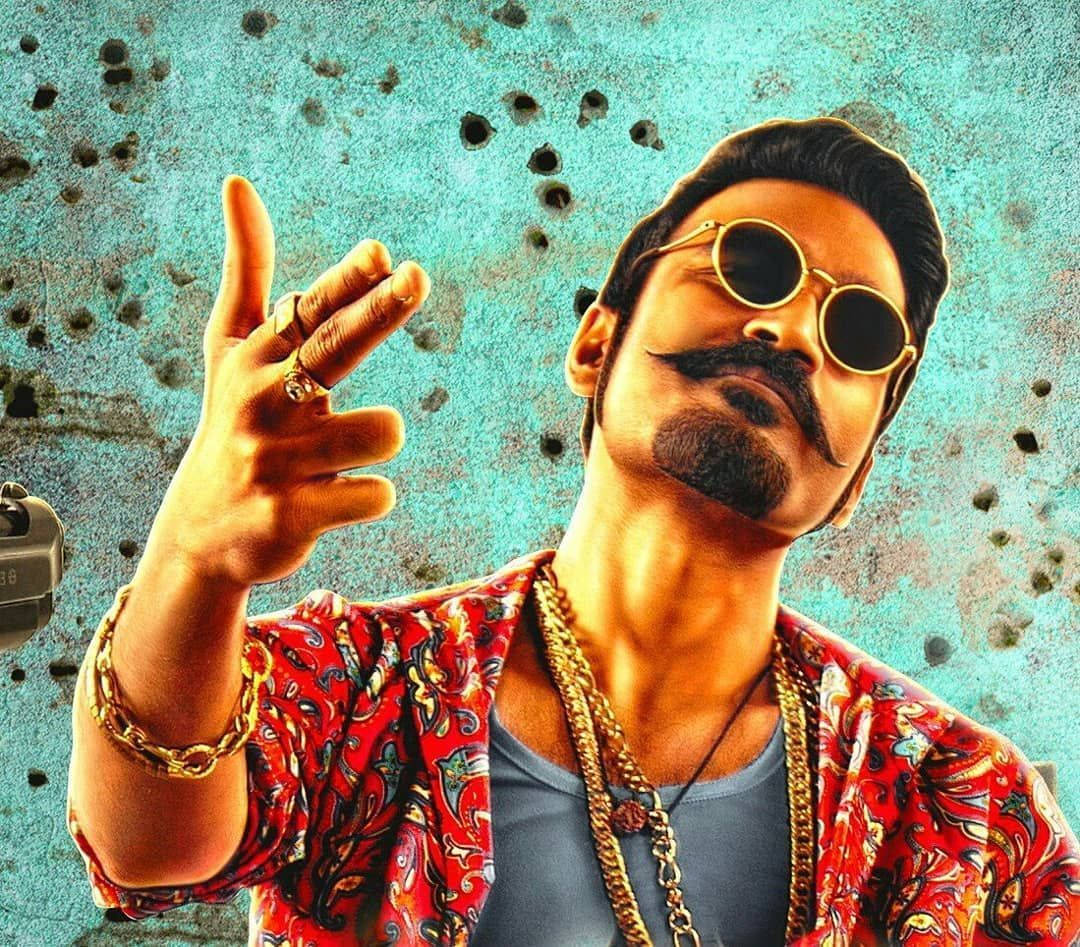 Maari Striking Confident Poses With A Fierce Expression Background