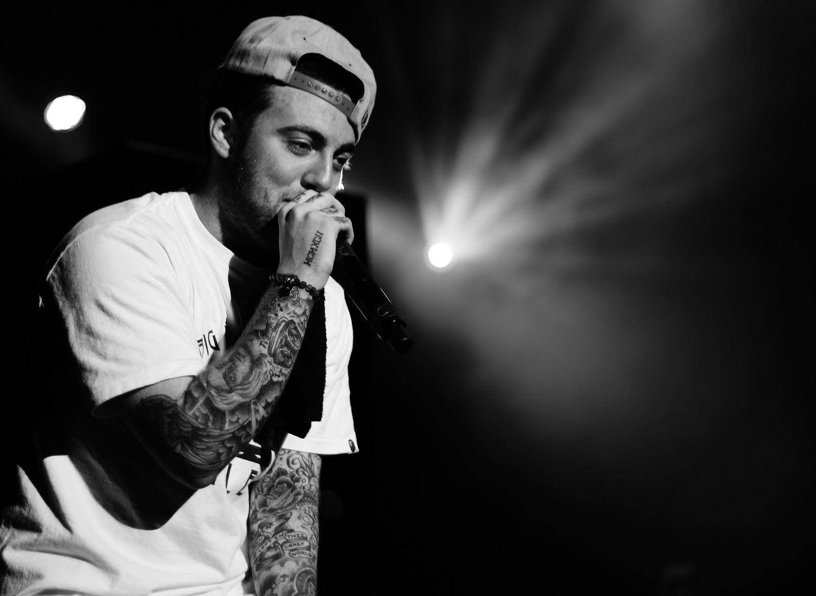 Mac Miller Performing In Black And White Background