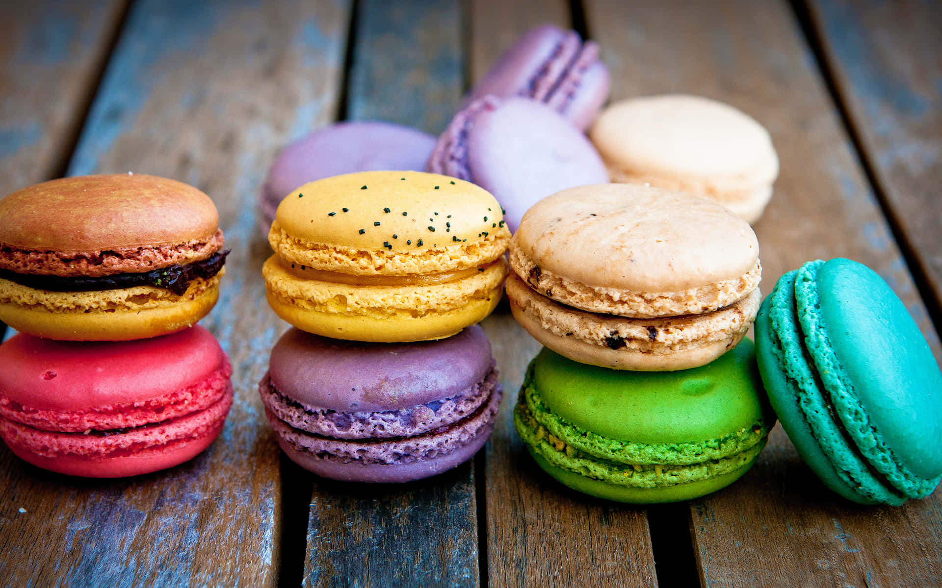 Macaron Stacked On Wooden Surface Background