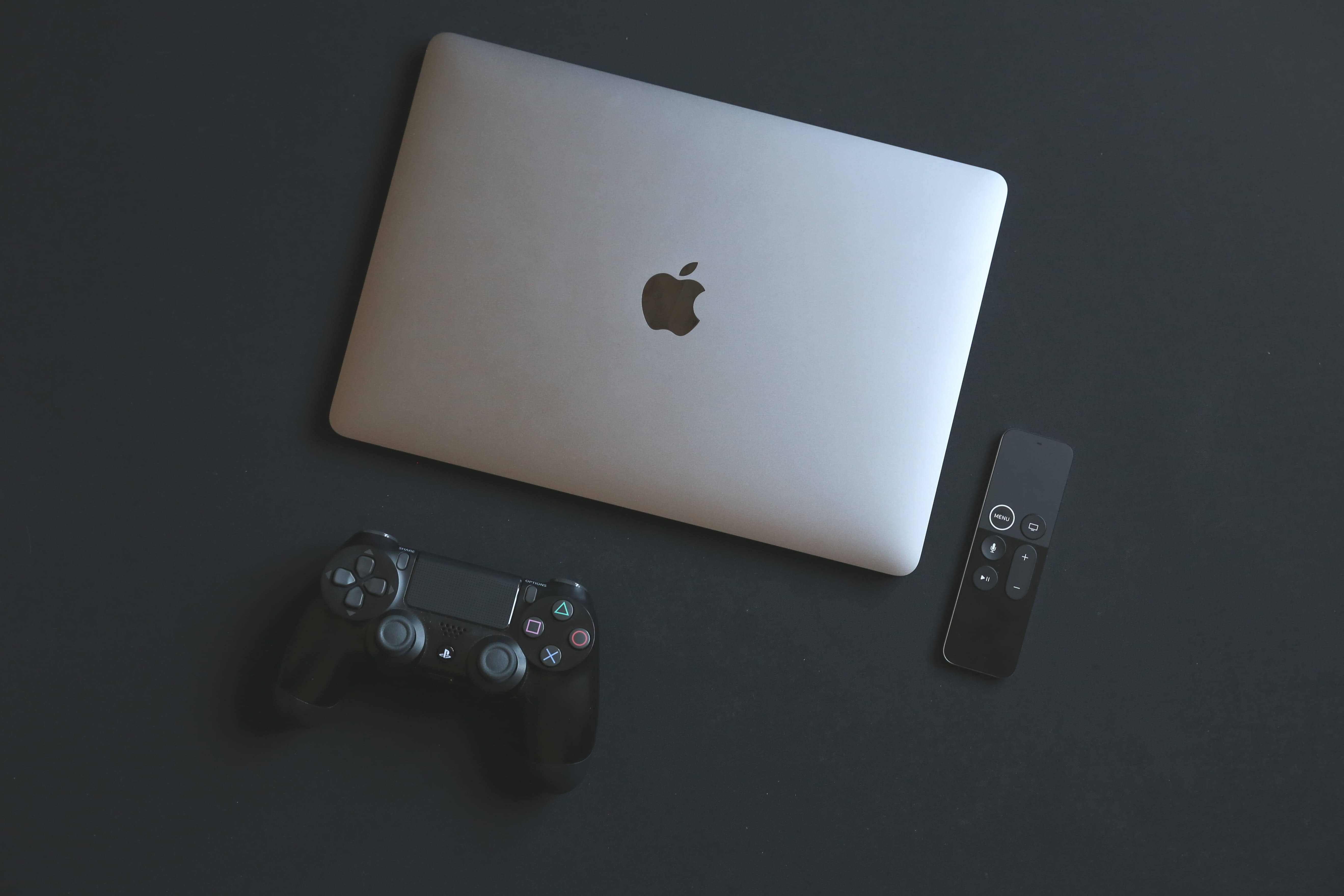 Macbook Gaming Laptop With Black Controller Background