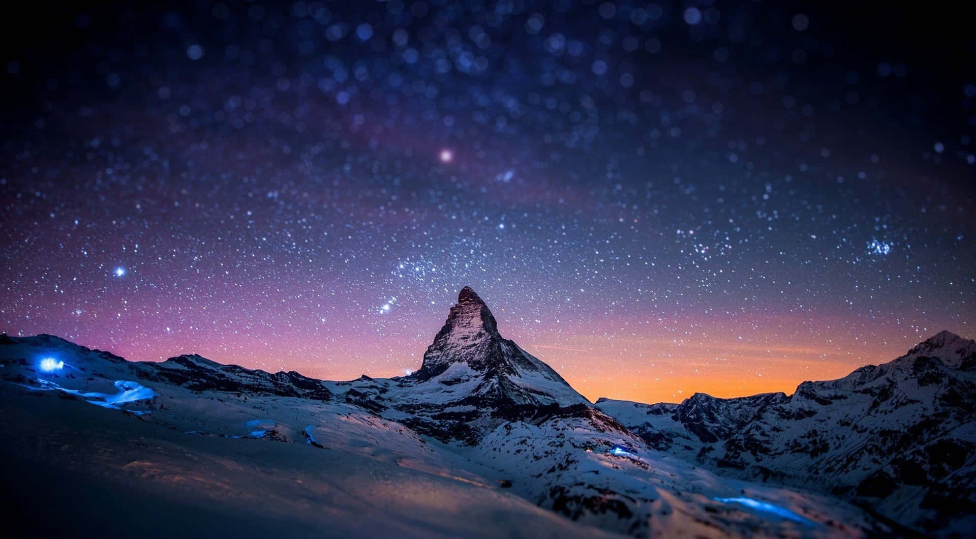 Macbook Retina With Stars Above Mountain Background