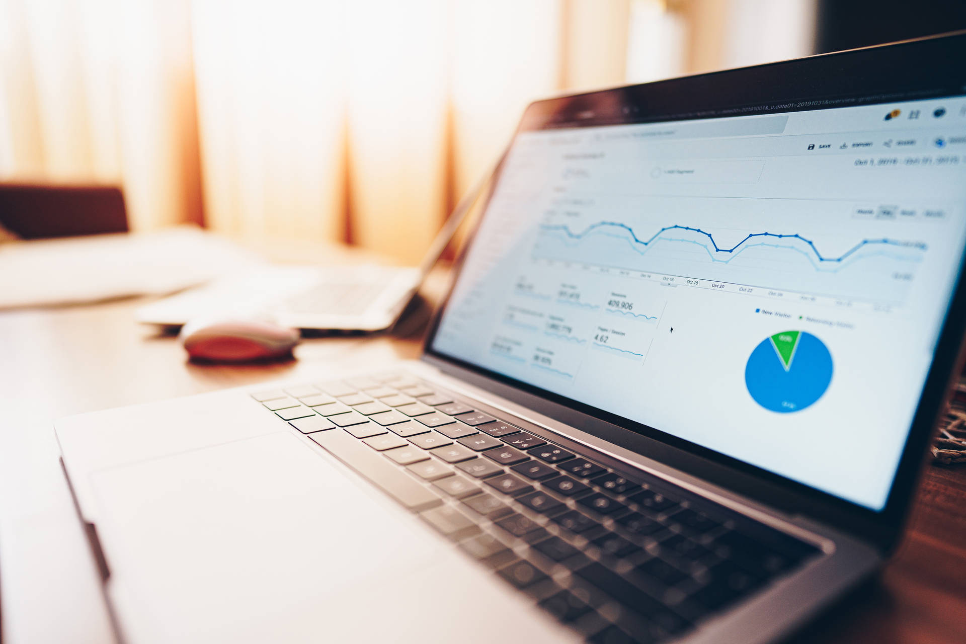 Macbook Showing Website Traffic Analytics Background