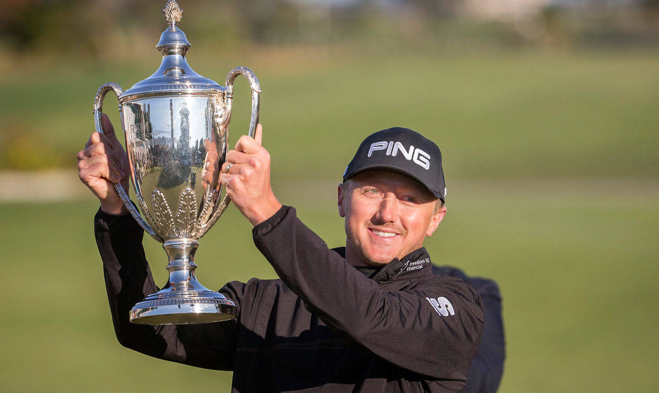 Mackenzie Hughes Raising His Trophy Background