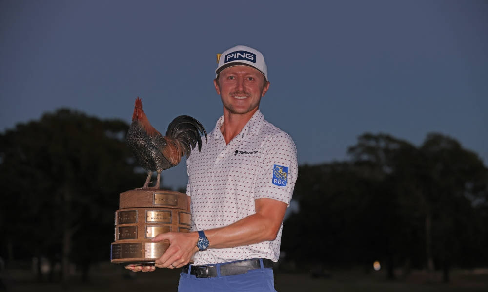 Mackenzie Hughes Smiling Holding Trophy Background