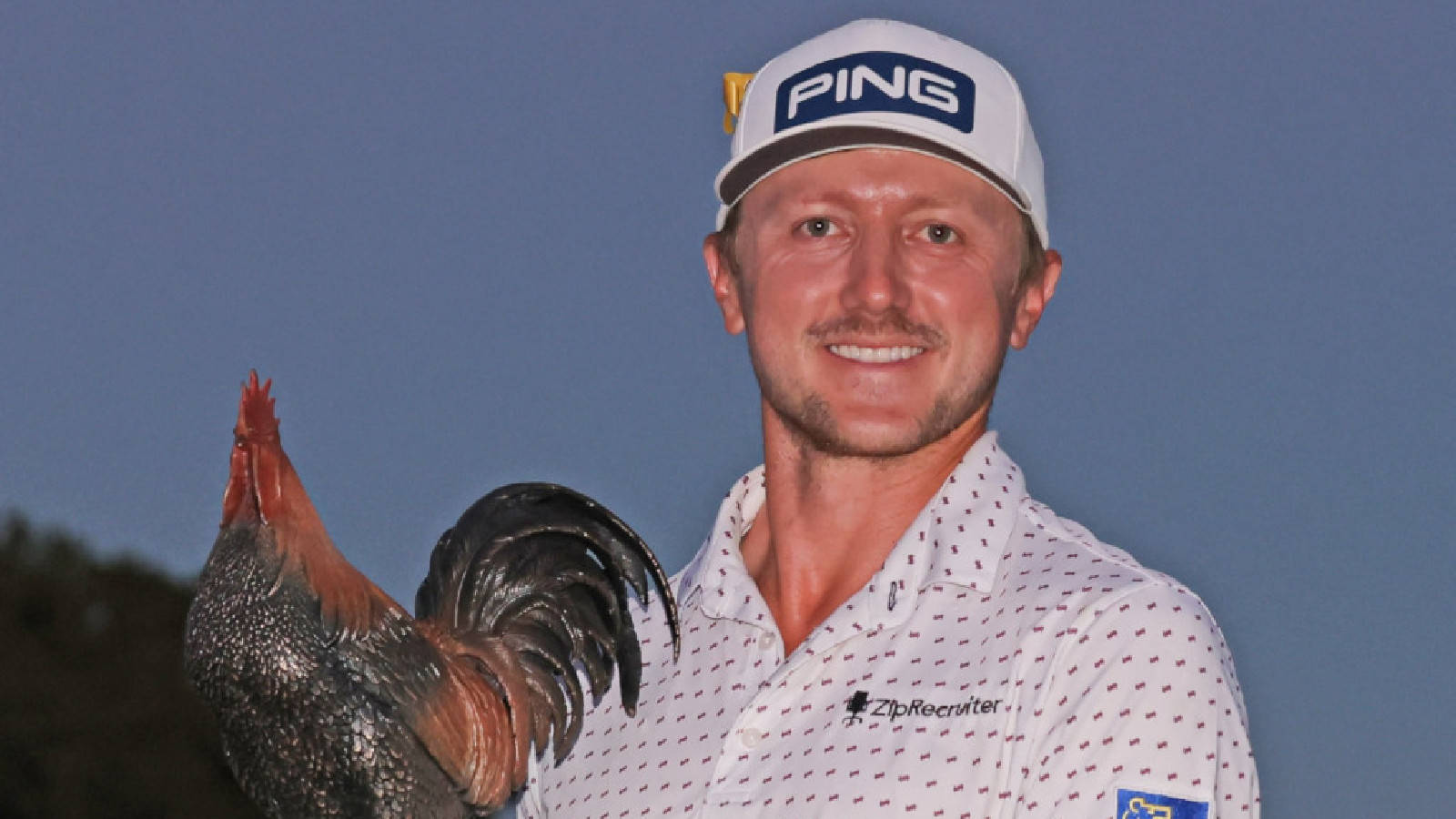 Mackenzie Hughes With Trophy At Night Background