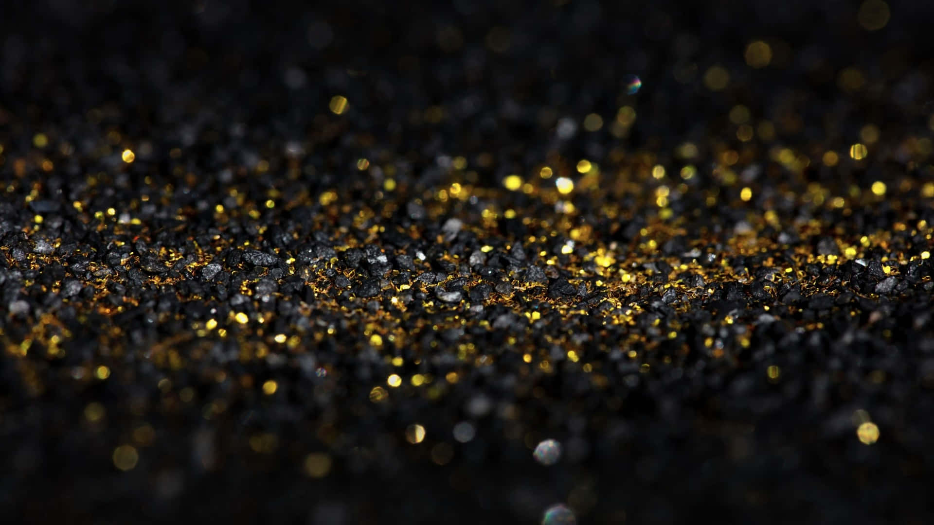 Macro Black And Gold Glitter Particles Background