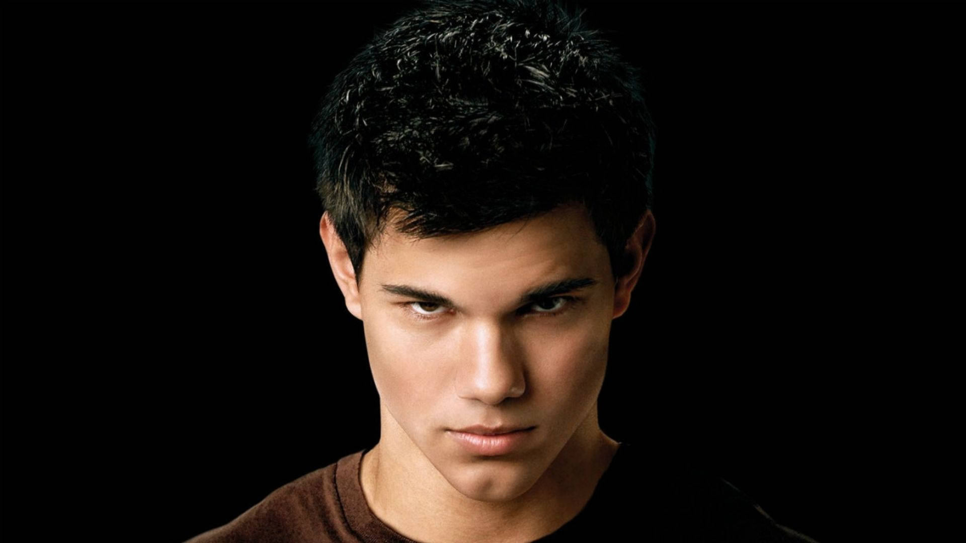 Mad Looking Taylor Lautner Background