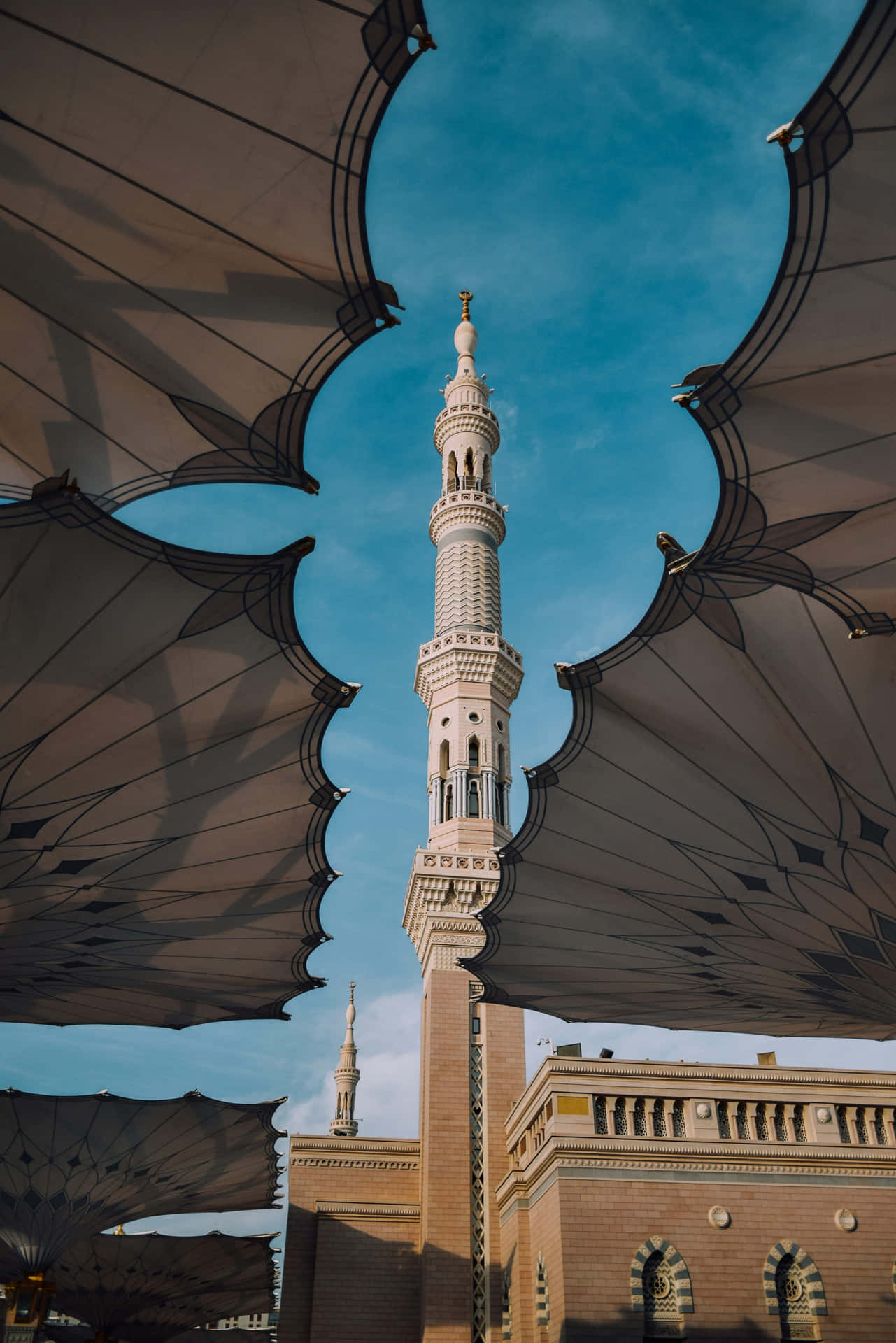 Madina Mosque Minaret Under Umbrellas Background